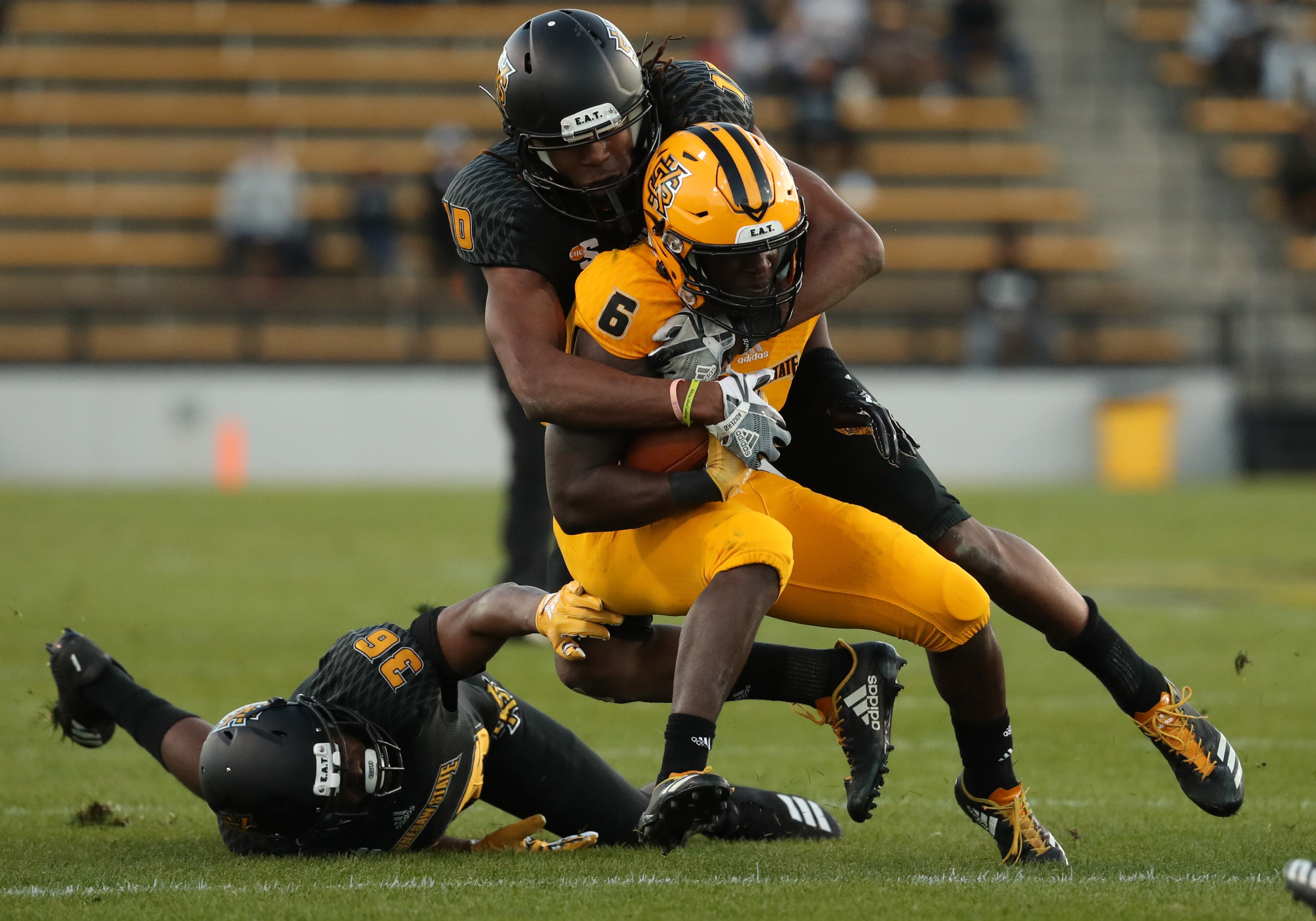 March 22, 2019 - Kennesaw, Ga: Kennesaw State Owls running back TJ Reed (6) is tackled by defensive back Quae Drake (10) during the KSU spring football game at Fifth Third Bank Stadium Friday, March 22, 2019 in Kennesaw, Ga.. (JASON GETZ/SPECIAL TO THE AJC)