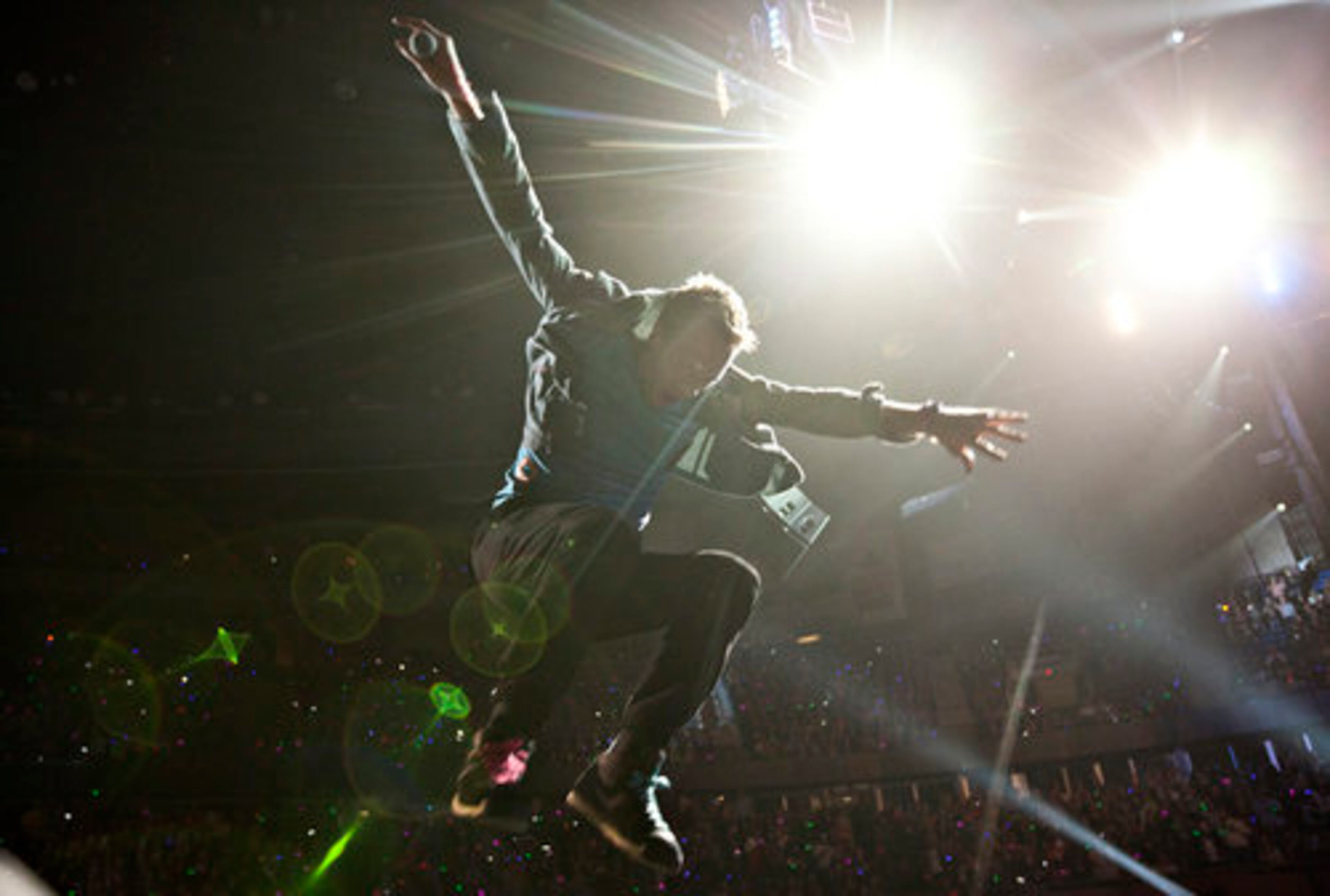 Chris Martin jumps off the stage set. Coldplay, which played Music Midtown last year, brings its tour to Philips Arena July 2.