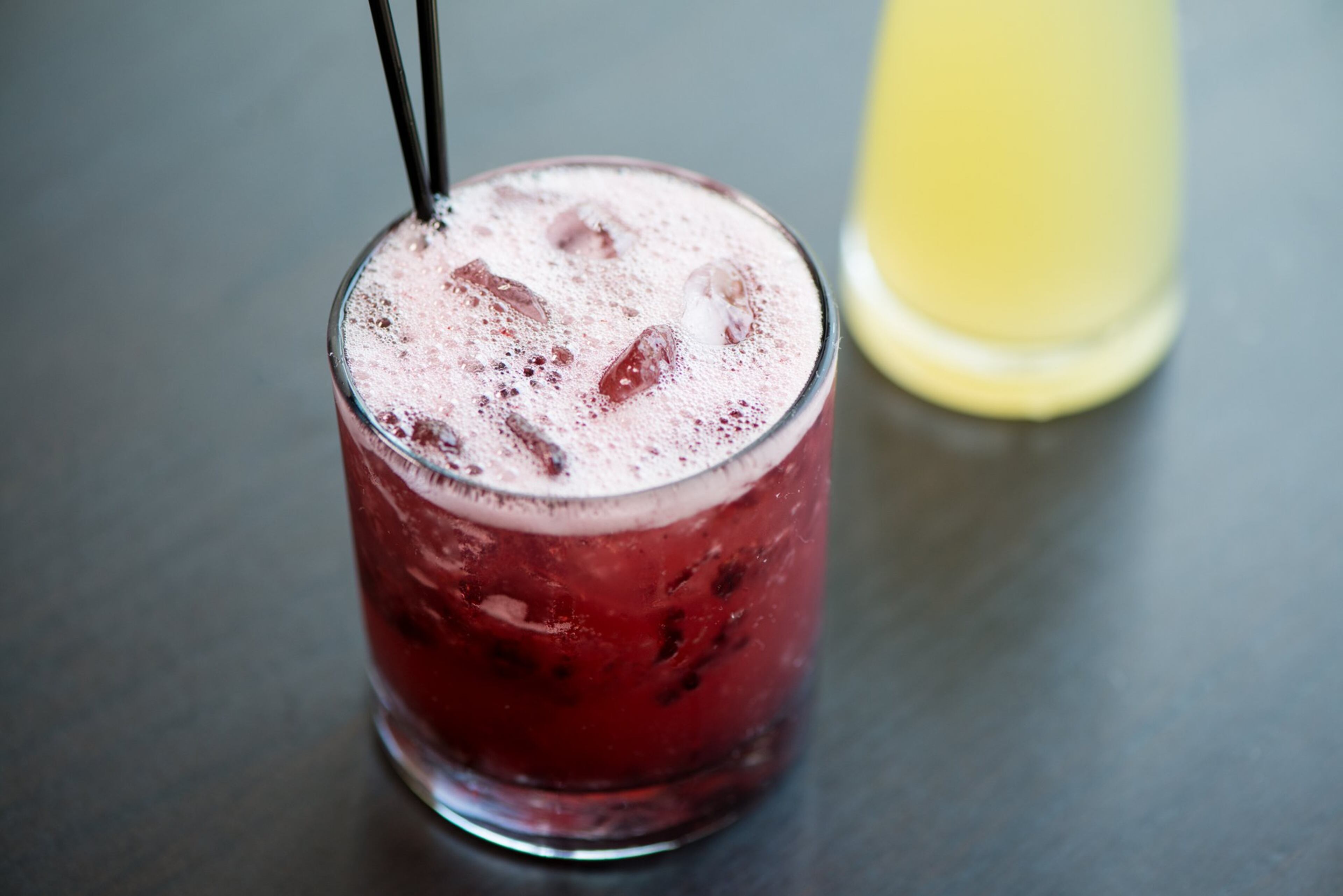 CO Blackberry Bourbon Fizz with bourbon, lychee, lemongrass, and muddled blackberries. Photo credit- Mia Yakel.