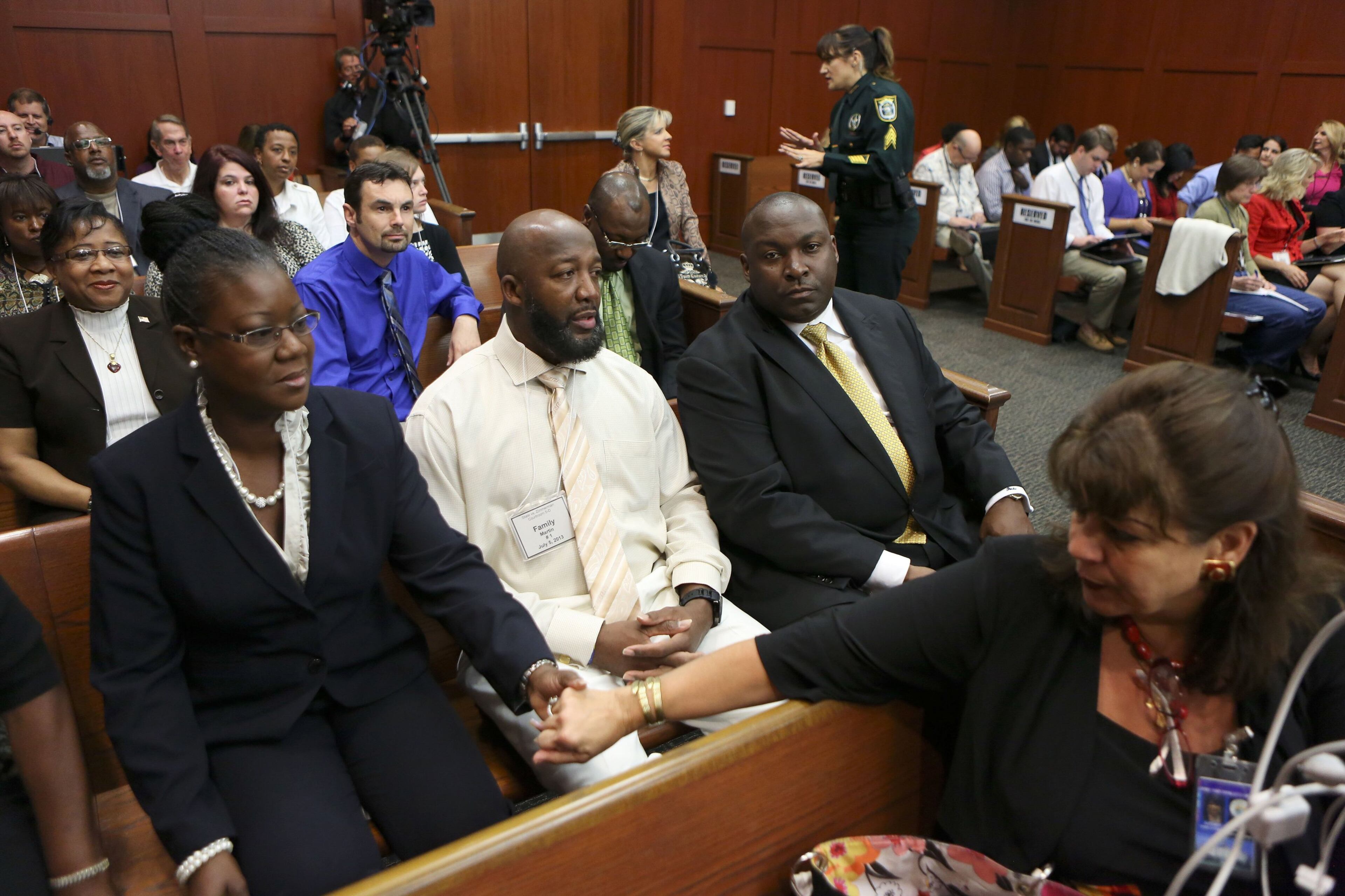 State Attorney Angela Corey, right, reaches to comfort Sybrina Fulton, Trayvon Martin's mother, before she takes the stand on Friday, July 5, 2013, in the trial of George Zimmerman in Sanford, Florida. Zimmerman is charged in the death of Trayvon Martin (Gary W. Green/Orlando Sentinel/MCT)