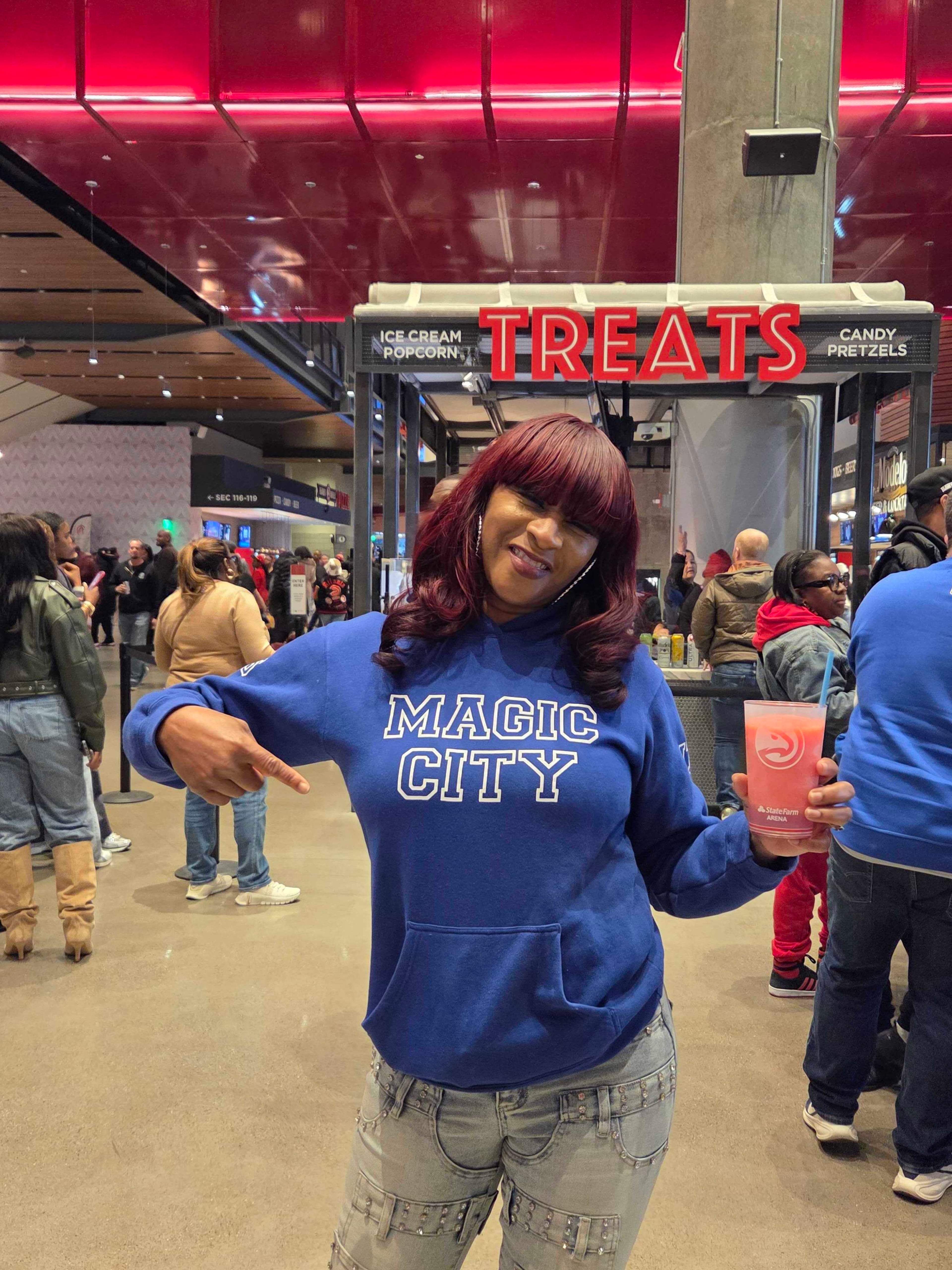 Strawberry, a former dancer at Atlanta's Magic City, attends Monday night's Hawks game against the Orlando Magic. She was featured in the Magic City documentary. (DeAsia Paige/AJC)