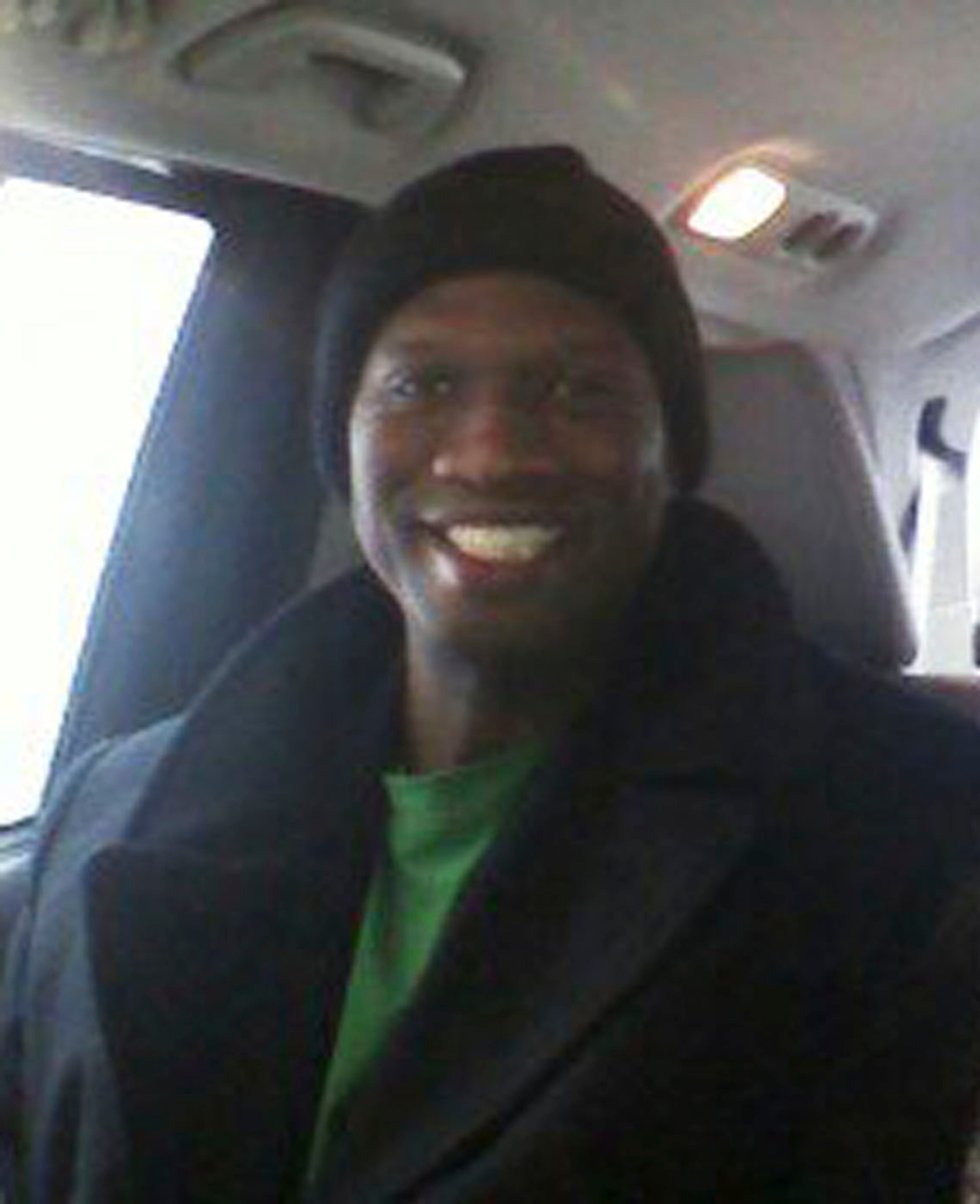 This undated cell phone photo provided by Kristi Kinard Suthamtewakul shows a smiling Aaron Alexis in Fort Worth, Texas. The FBI has identified Alexis, 34, as the gunman in the Monday, Sept. 16, 2013 shooting rampage at at the Washington Navy Yard in Washington that left thirteen dead, including himself. (AP Photo/Kristi Kinard Suthamtewakul)