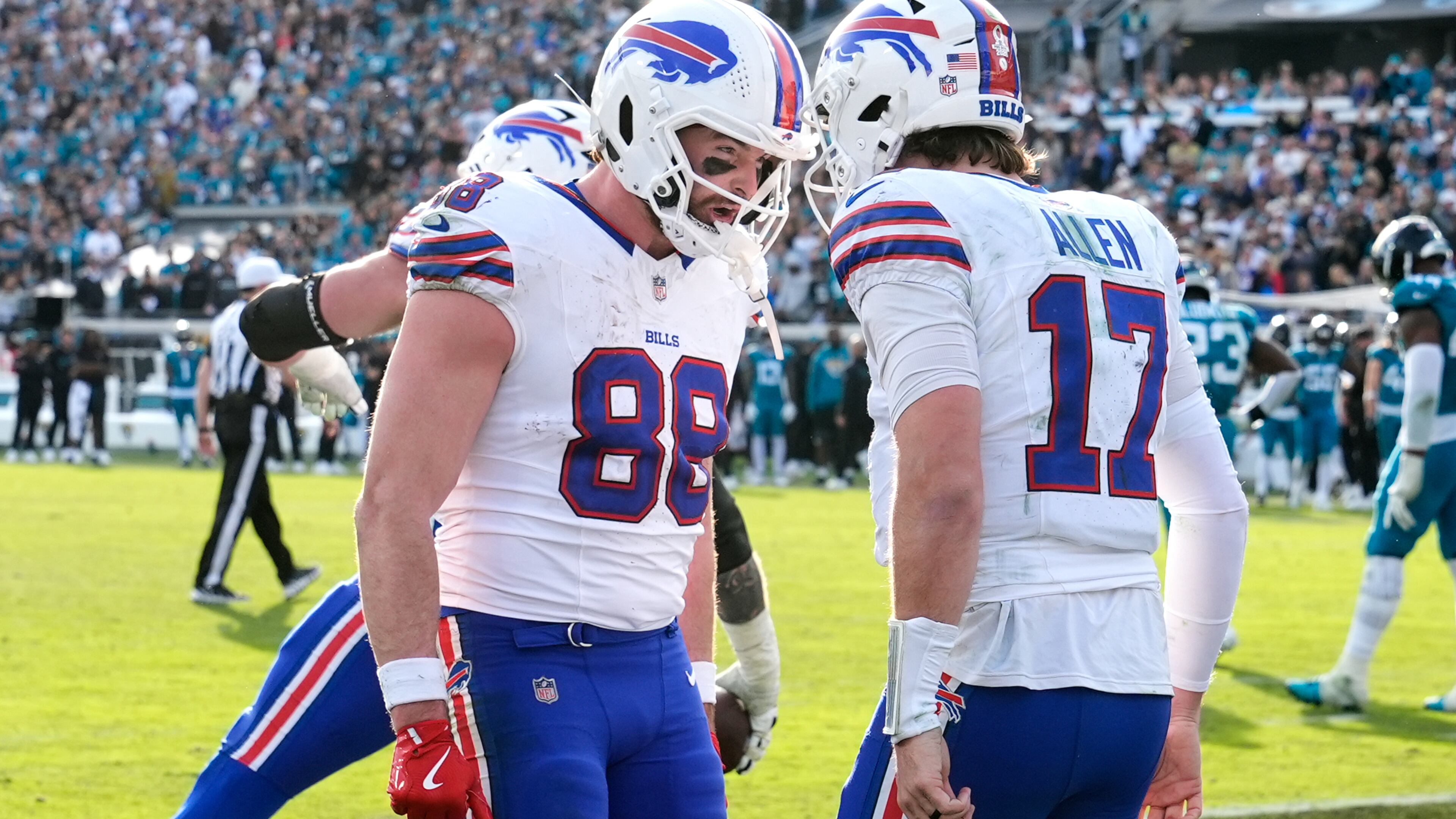 Buffalo Bills quarterback Josh Allen (17) celebrates his touchdown with tight end Dawson Knox (88) during the second half of an NFL wild-card playoff football game against the Jacksonville Jaguars Sunday, Jan. 11, 2026, in Jacksonville, Fla. (AP Photo/Chris O'Meara)