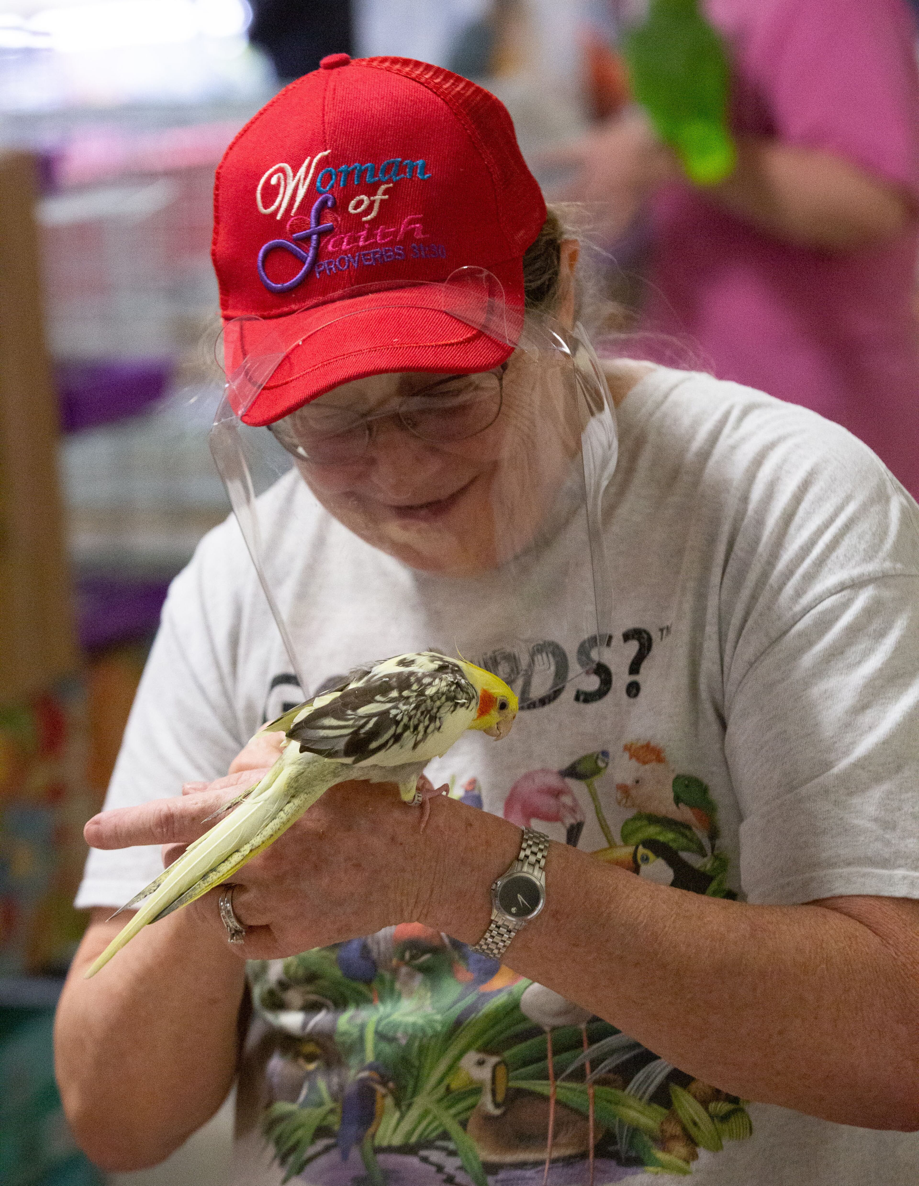 Brenda Bean from Parrot Productions pets a customer's bird after she trimmed its beak at the Southeast Exotic Bird Fair at the Gwinnett County Fairgrounds on Saturday, December 5, 2020. (Photo: Steve Schaefer for The Atlanta Journal-Constitution)