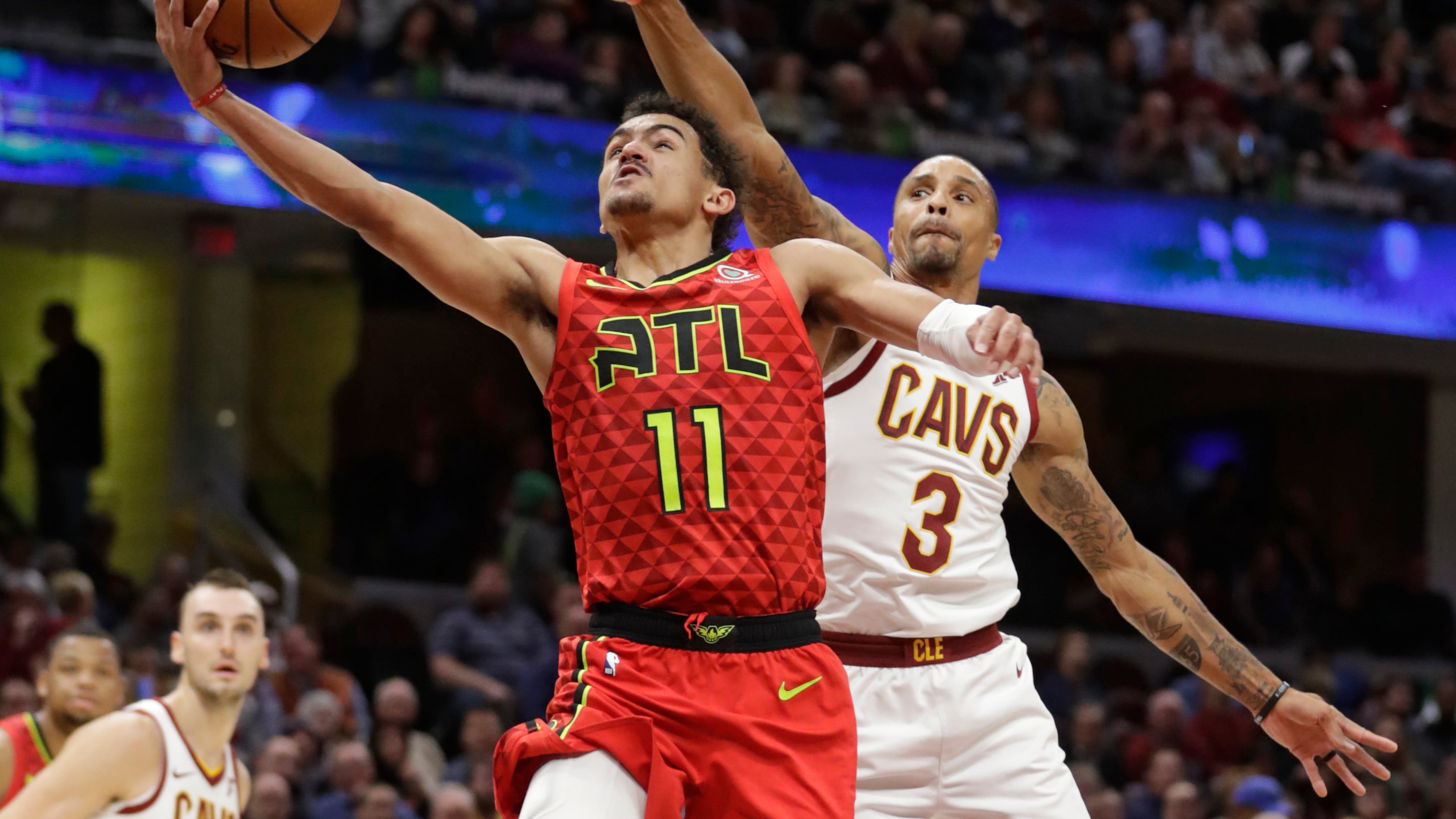 Hawks' Trae Young (11) drives to the basket against the Cleveland Cavaliers' George Hill (3). (AP Photo/Tony Dejak)