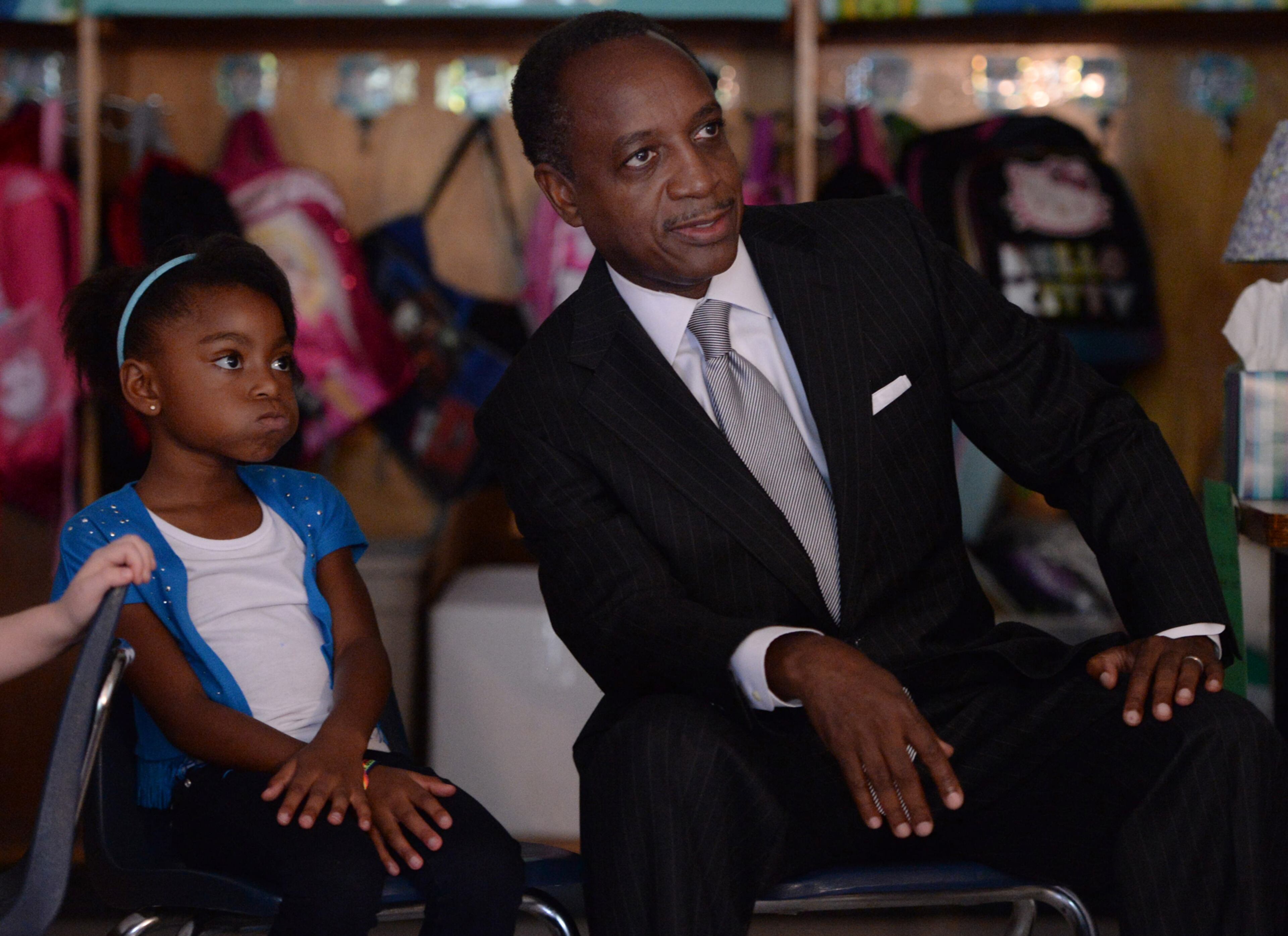 Jada Davis watches an animated program with DeKalb County School District Superintendent Michael Thurmond on the first day of school at Midvale Elementary on Monday, August 12, 2013. JOHNNY CRAWFORD / JCRAWFORD@AJC.COM