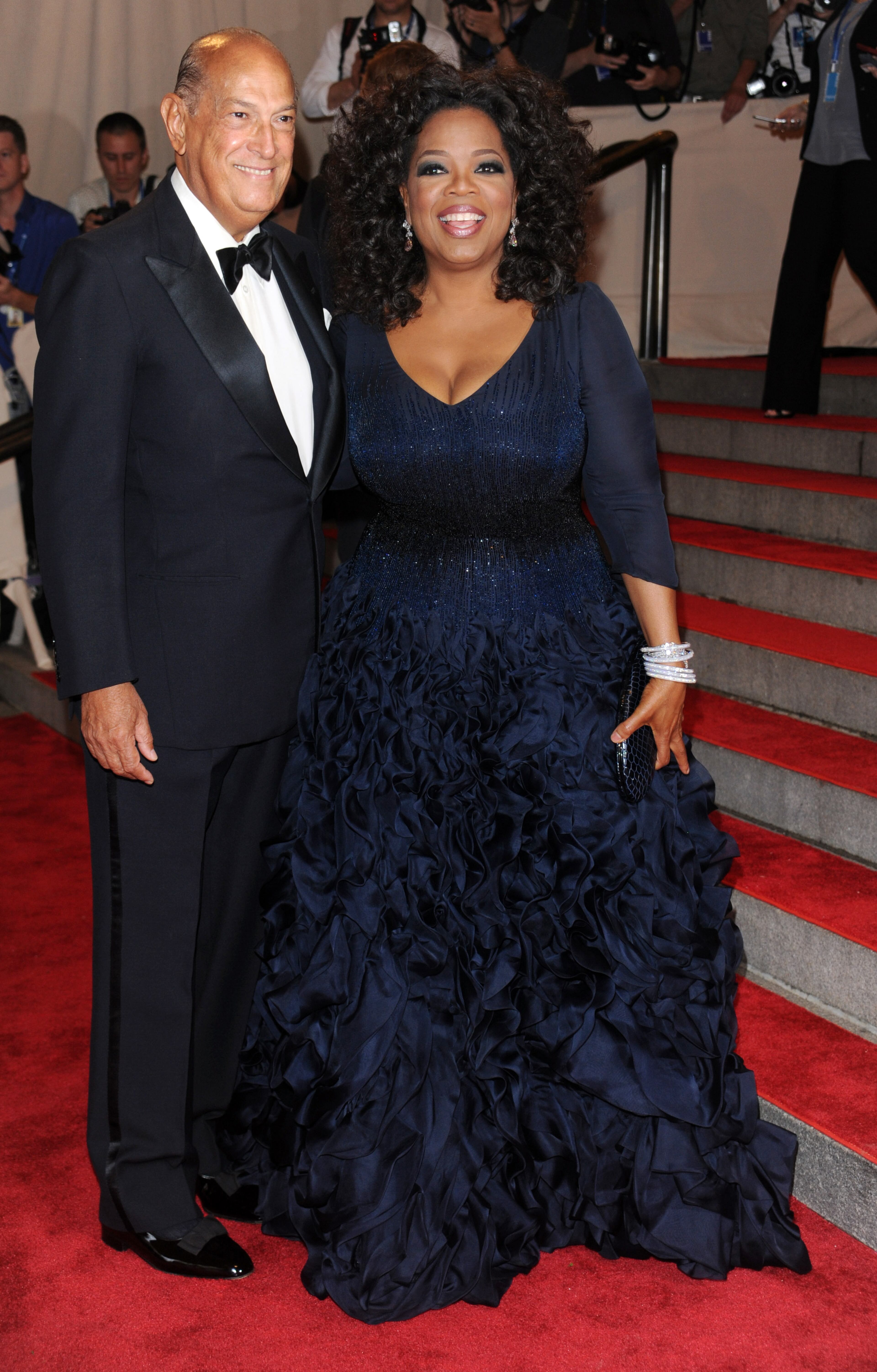 In this May 3, 2010 file photo, Oprah Winfrey, right, and Oscar de la Renta arrive at the Metropolitan Museum of Art Costume Institute gala, in New York. The designer, de la Renta, a favorite of socialites and movie stars alike, has died. He was 82. (AP Photo/Evan Agostini, File)