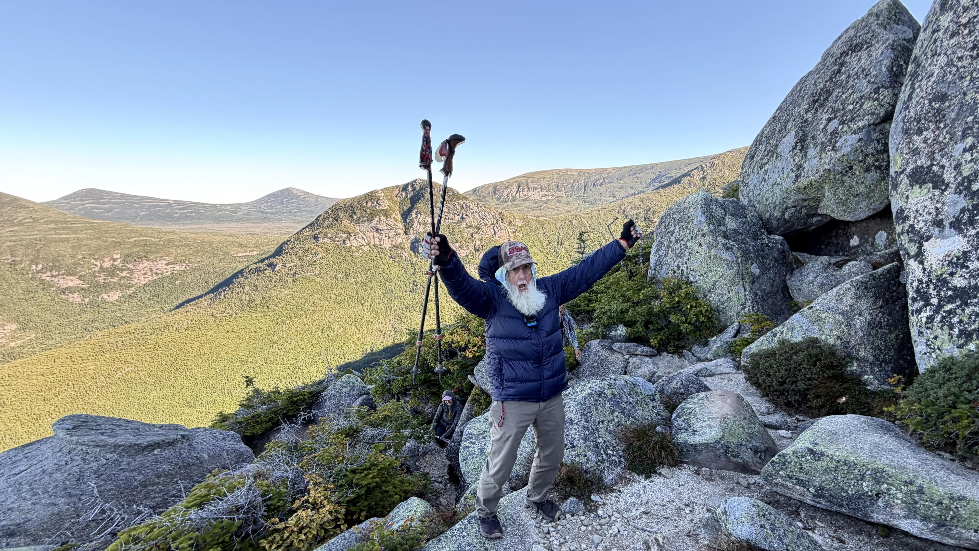 Dale Sanders, 91, celebrates after completing a difficult section of Mt. Katahdin, Monday, Aug. 31, 2026, in Baxter State Park in Piscataquis County, Maine. (AP Photo/Robert F. Bukaty)