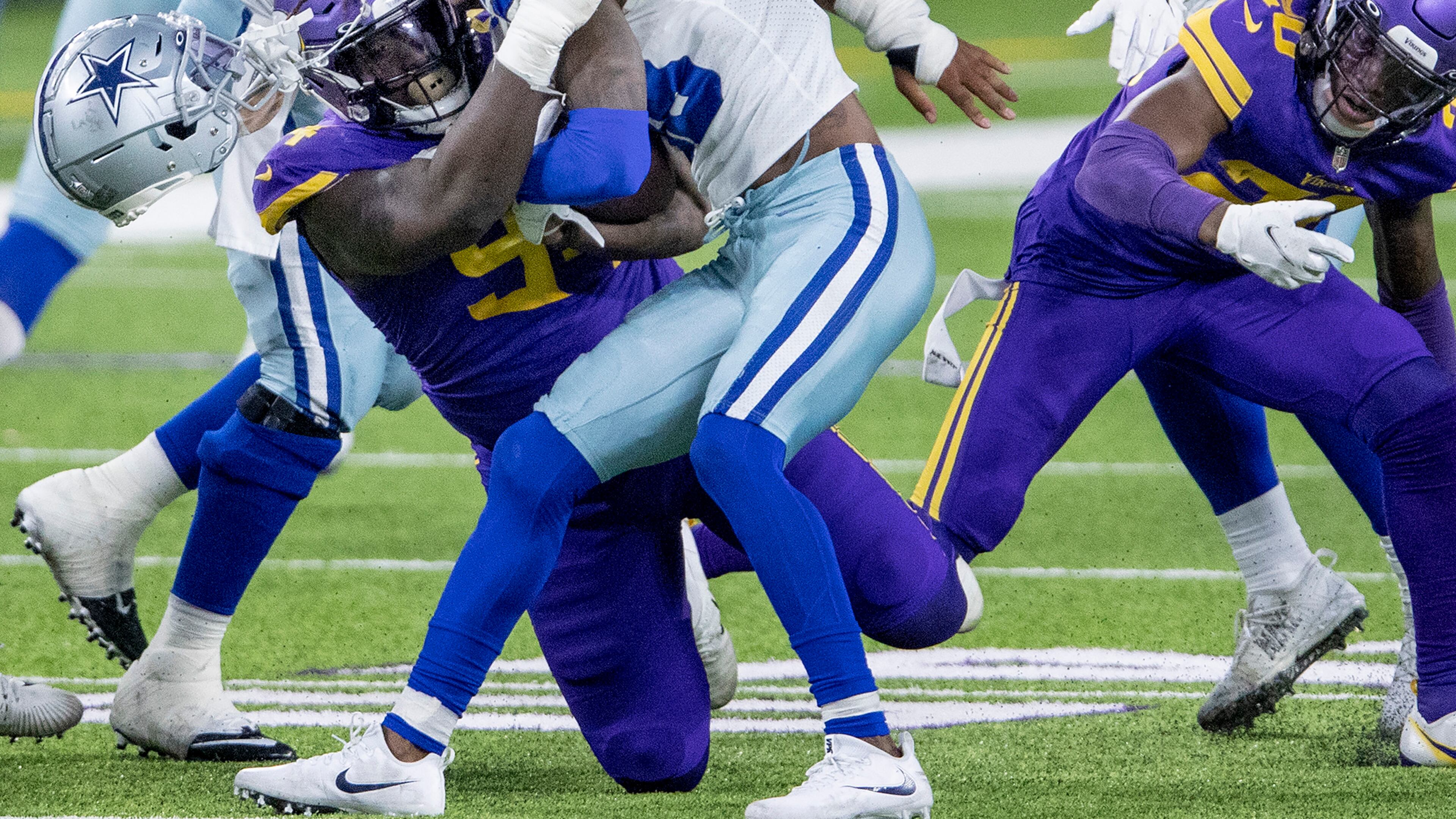 Dallas Cowboys receiver CeeDee Lamb (88) has his helmet knocked off after a collision with Minnesota Vikings' Jaleel Johnson (94) in the second quarter on Sunday, Nov. 22, 2020 at U.S. Bank Stadium in Minneapolis, Minn. (Carlos Gonzalez/Minneapolis Star Tribune/TNS)