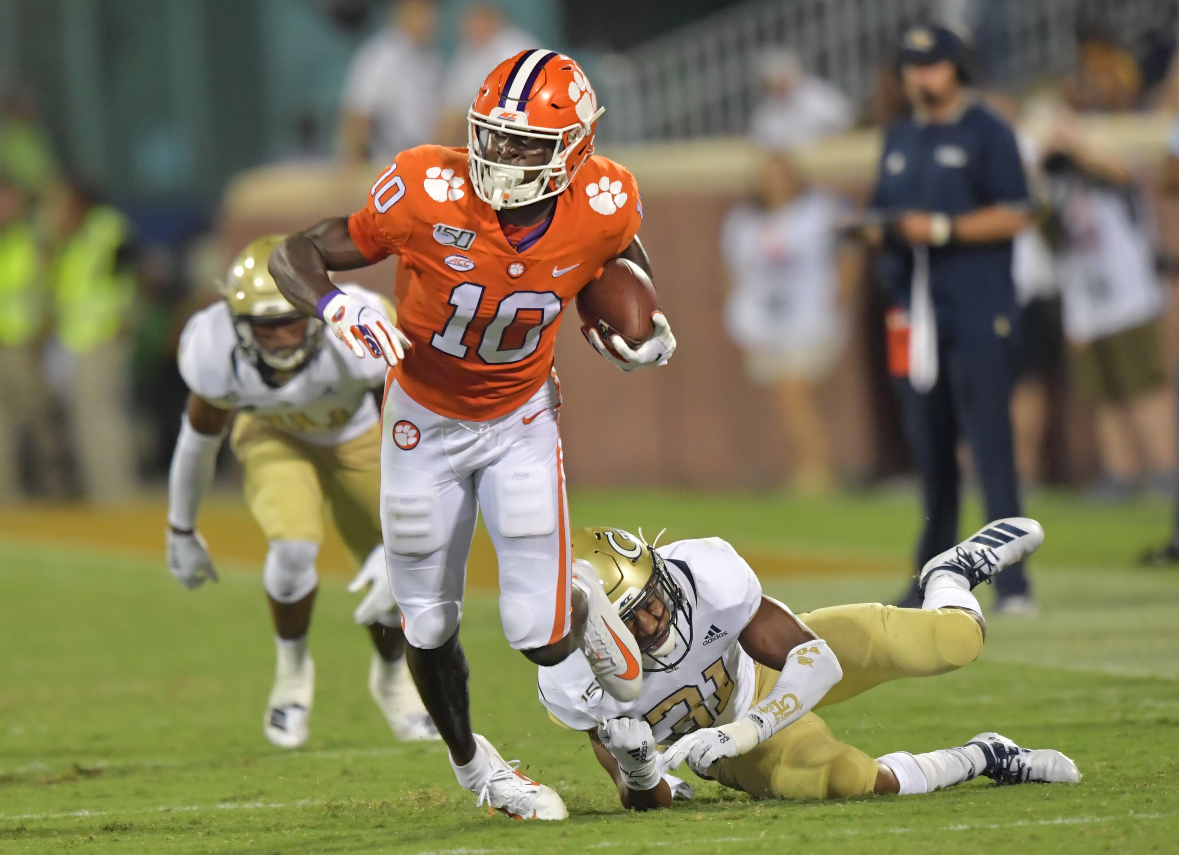Clemson wide receiver Joe Ngata (10) eludes a tackle by Georgia Tech defensive back Kenan Johnson (31) in the second half at Memorial Stadium on the Clemson University campus in Clemson, S.C. on Thursday, August 29, 2019. Clemson won 52-14 over the Georgia Tech. (Hyosub Shin / Hyosub.Shin@ajc.com)