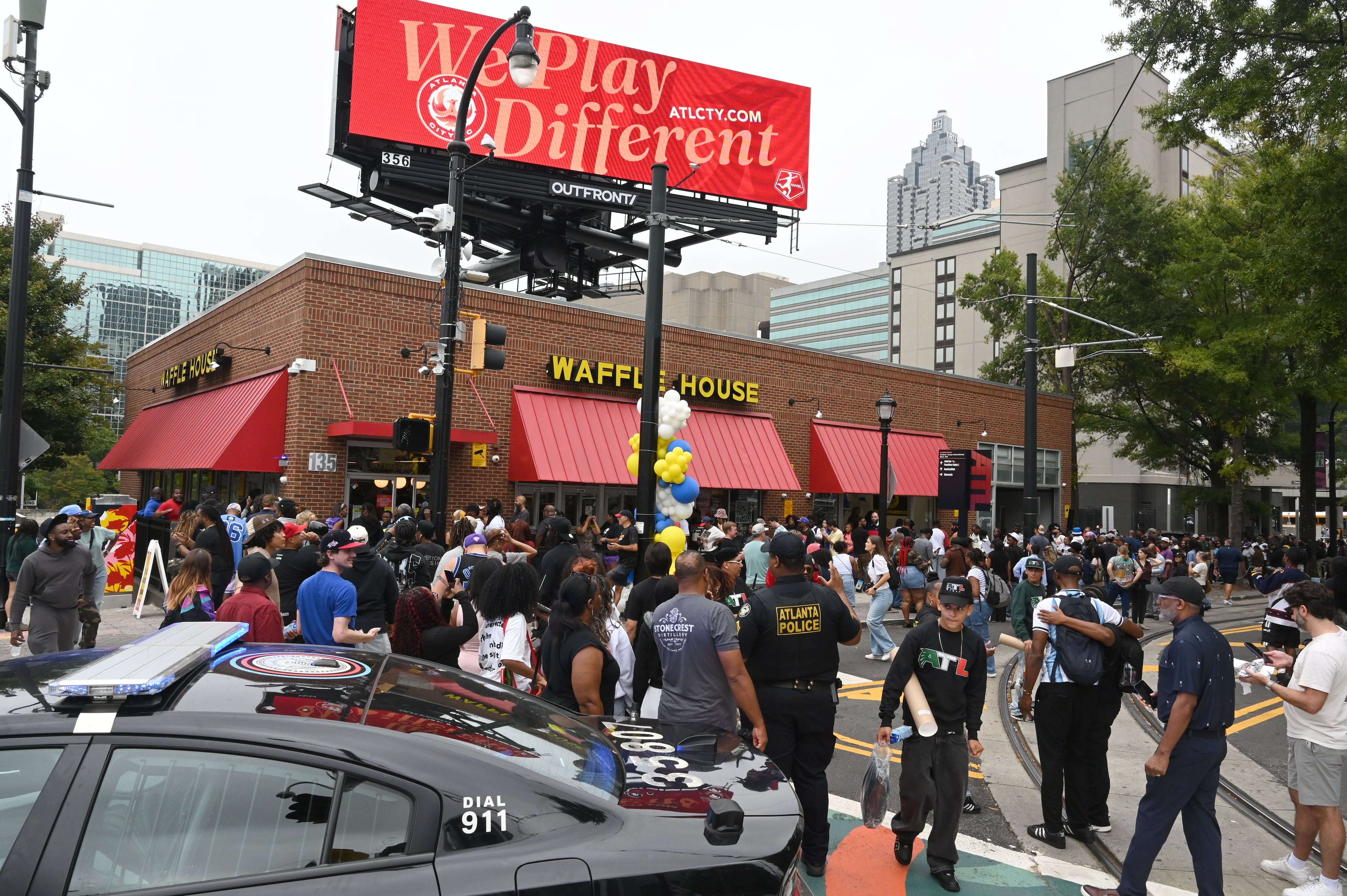 People bring their money and their patience to buy limited-edition apparel and accessories from the Outkast and Waffle House collaboration. (Hyosub Shin/AJC)