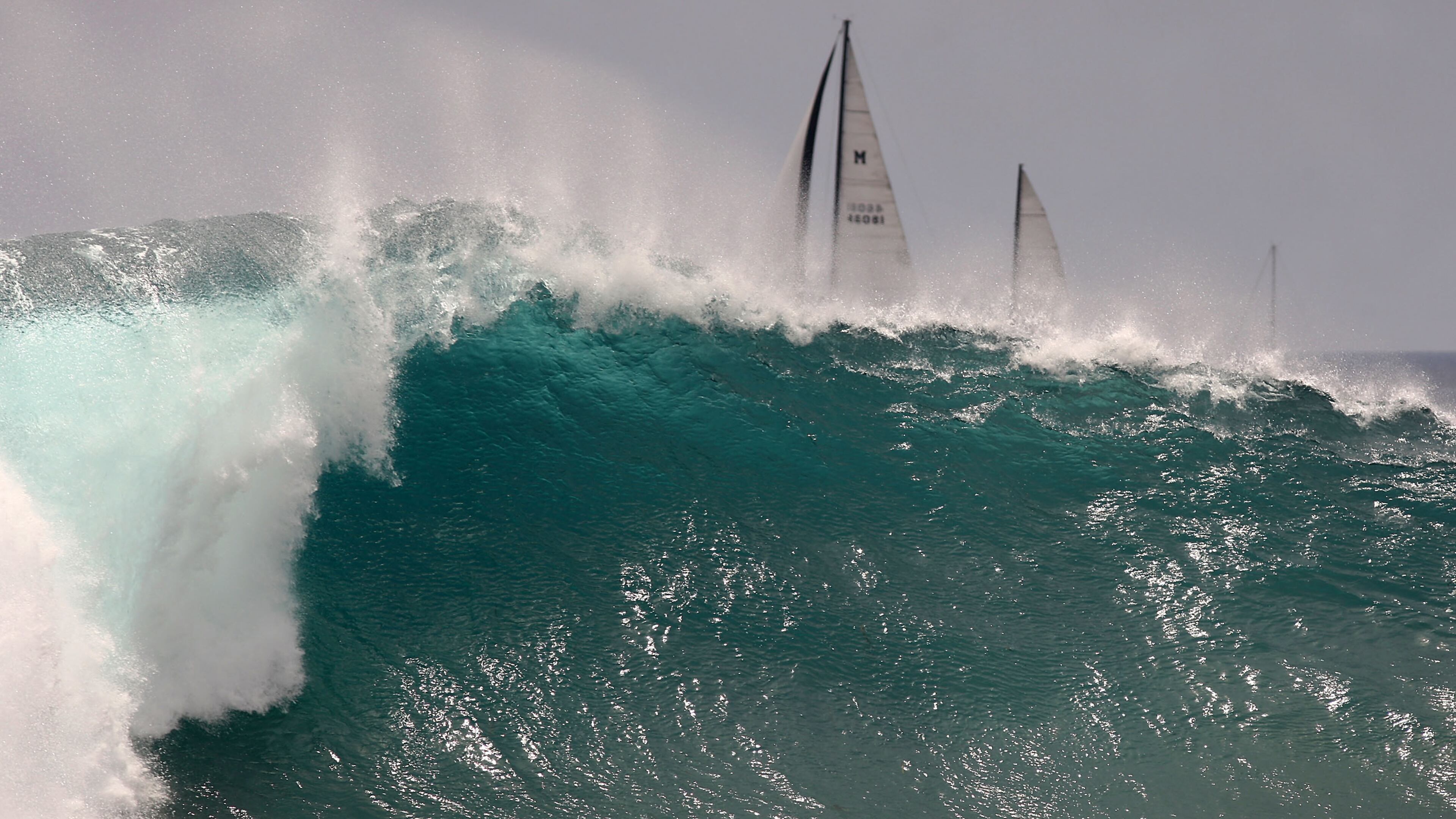 Dozens of people on a beach on North Carolina's Emerald Isle formed a human chain to rescue swimmers in rough waters Wednesday. Troy Strickland, 41, drowned.