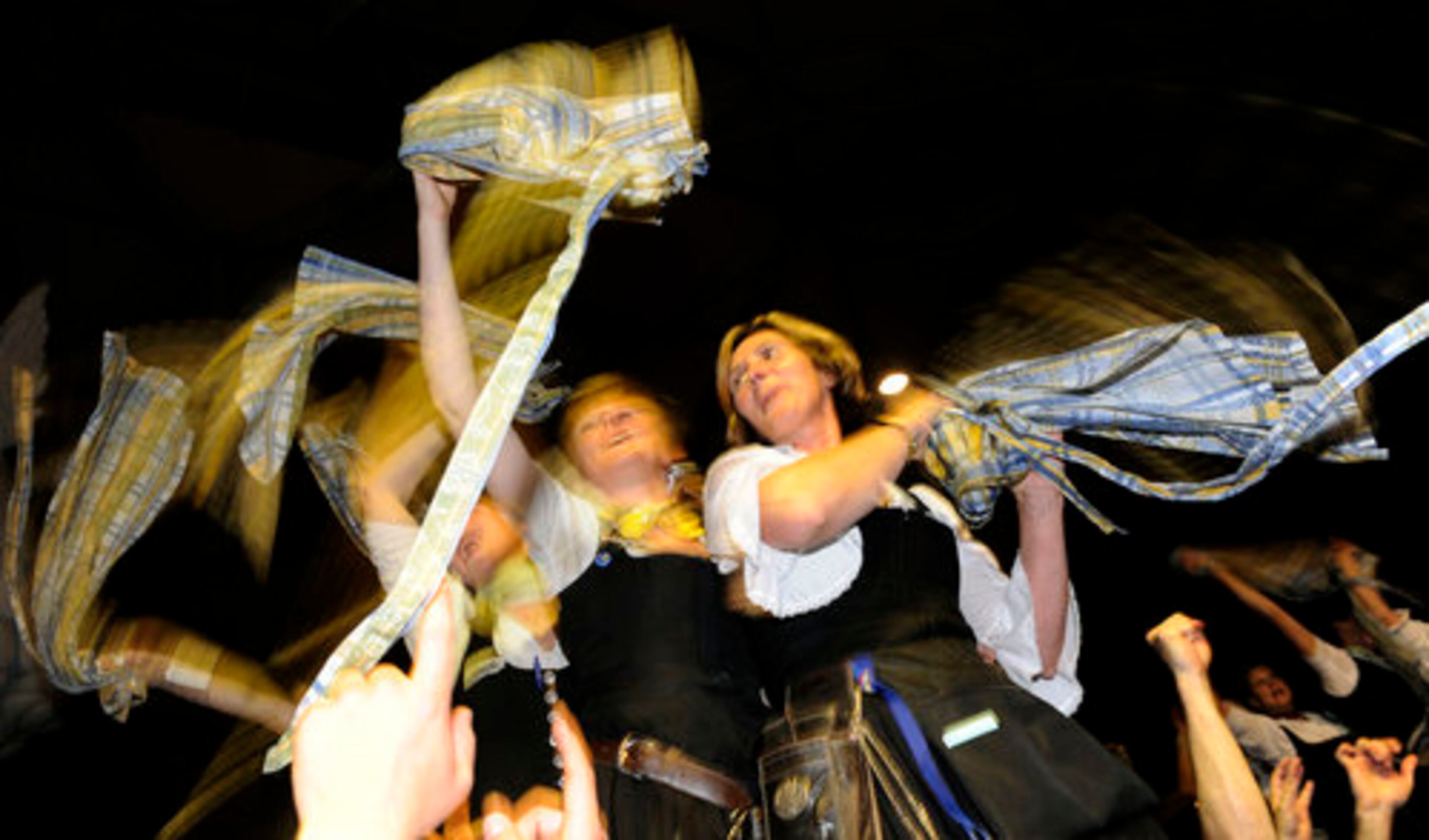 Waitresses swing skirts and celebrate the end of the Oktoberfest 2008 beer festival in Munich, Germany, on Sunday evening. Thousands visited the world largest beer festival during the last two weeks.