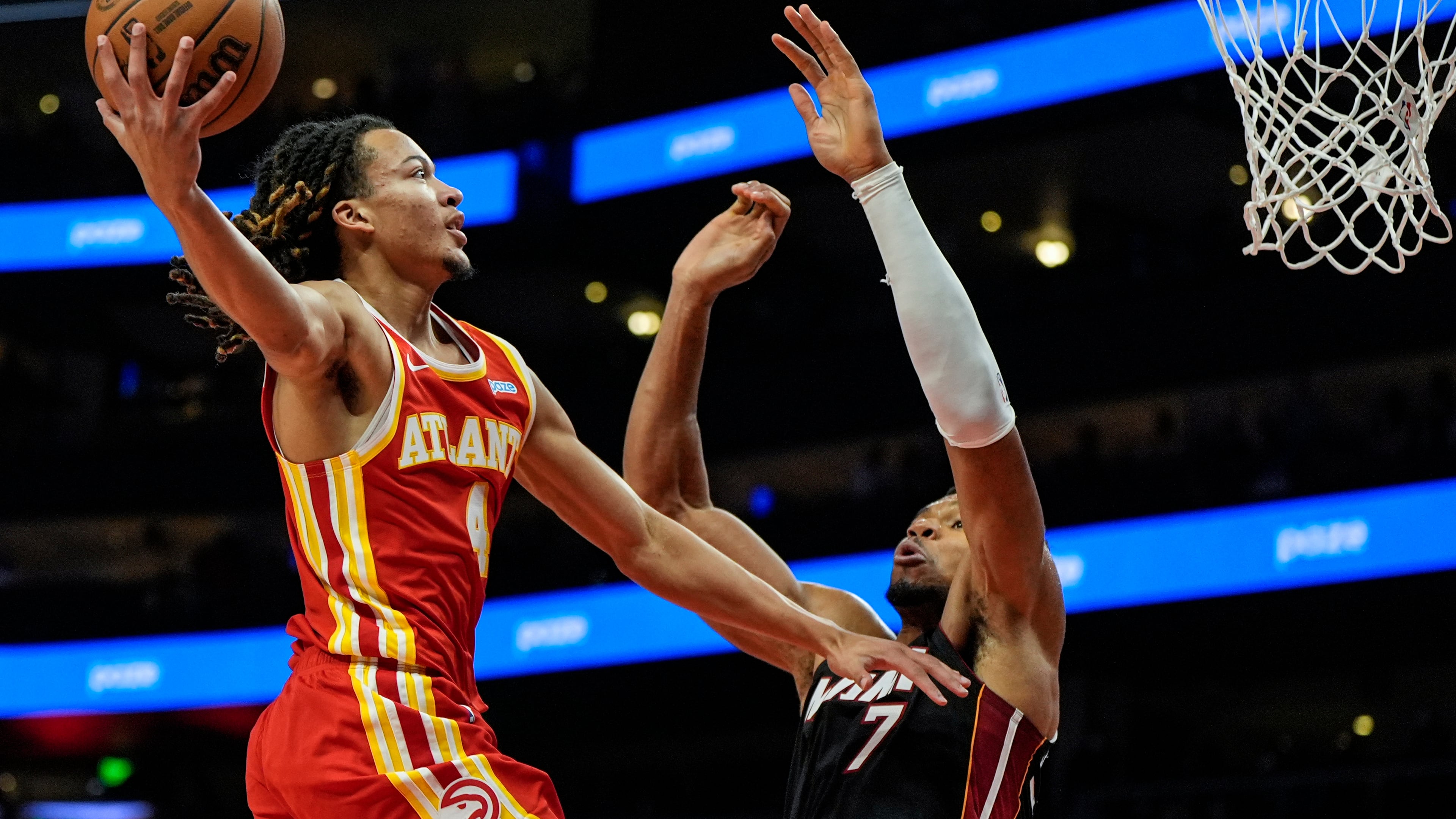 Atlanta Hawks guard Kingston Flemings (4) shoots against Miami Heat forward Giannis Antetokounmpo (7) during the first half of an NBA basketball game, Wednesday, Oct. 28, 2026, in Atlanta. Flemings scored 23 points for the Hawks (Mike Stewart/AP)