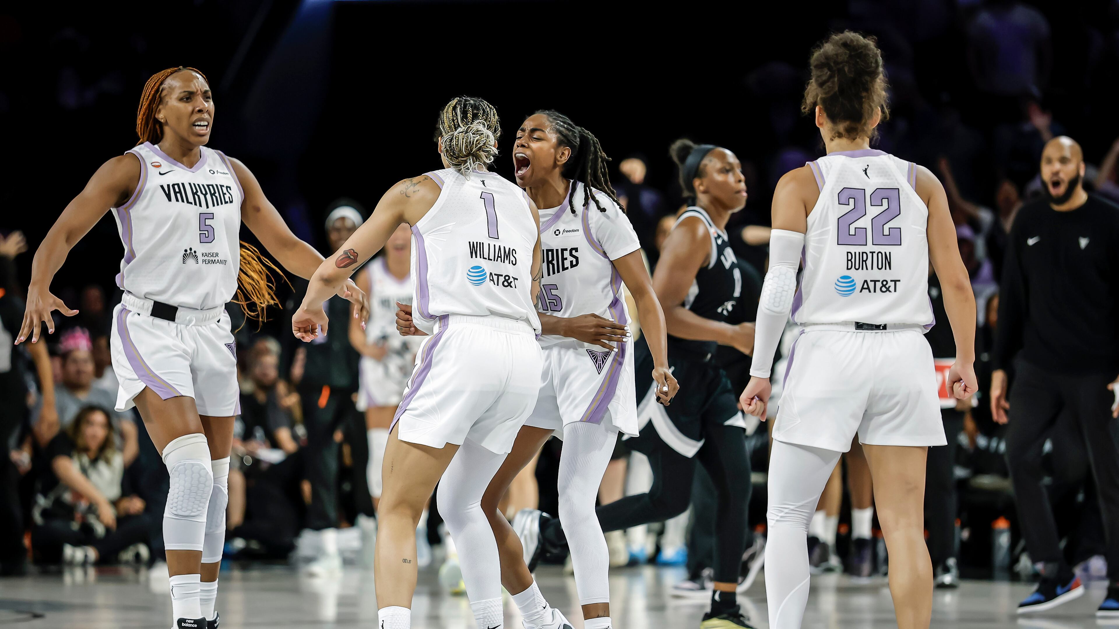 Golden State Valkyries players gather to celebrate teammate Gabby Williams's (1) 2-point basket in the final seconds of overtime as the team defeated the Las Vegas Aces in Game 3 of the WNBA basketball semifinals Friday, Oct. 9, 2026, in Las Vegas. (Carlos Avila Gonzalez/San Francisco Chronicle via AP)