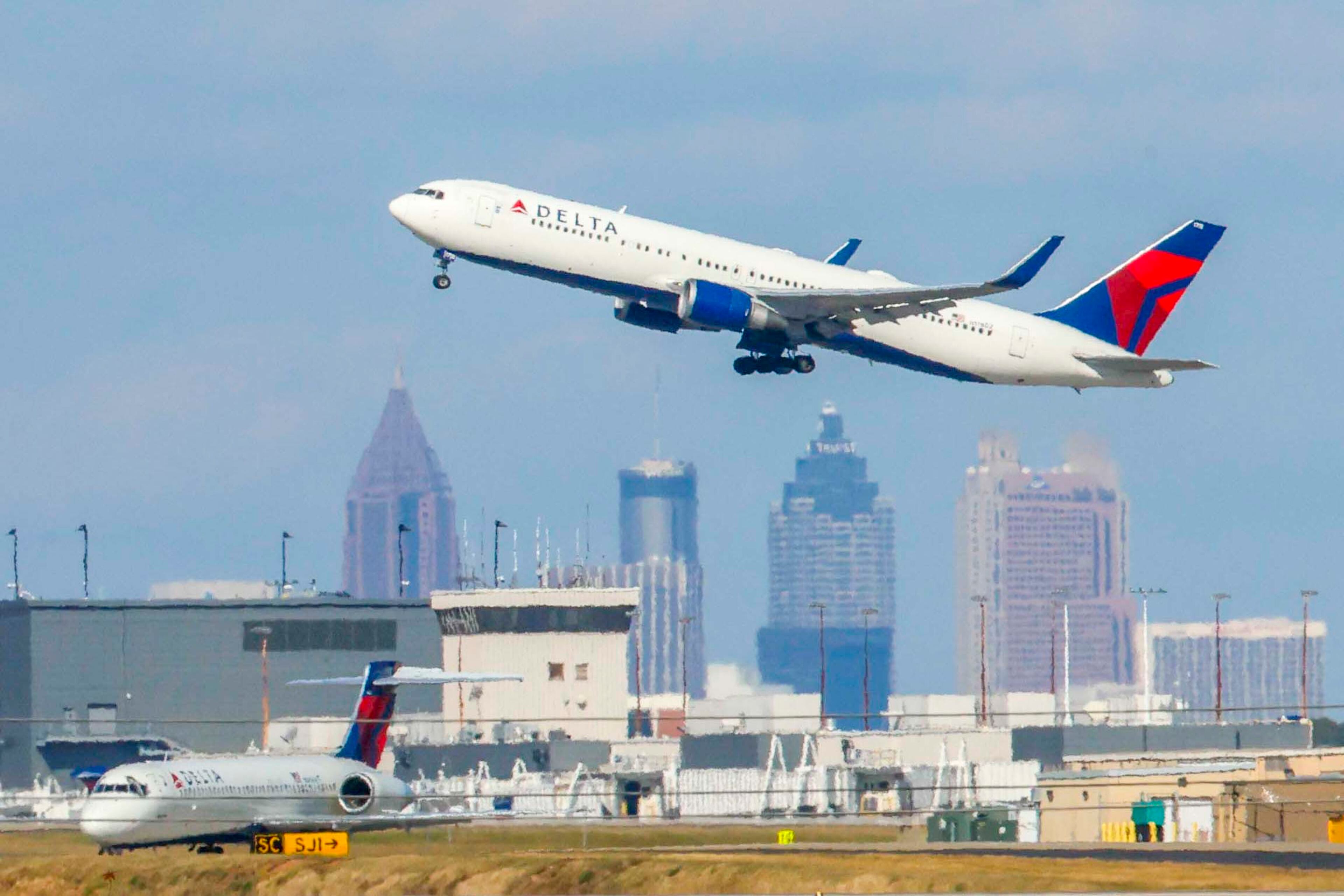 A Delta Air Lines plane is seen taking off at Hartsfield-Jackson Atlanta International Airport on Sunday, Nov. 9, 2025. The Federal Aviation Administration started reducing flights on Friday at 40 major airports, including Hartsfield-Jackson Atlanta International Airport.
(Miguel Martinez/ AJC)