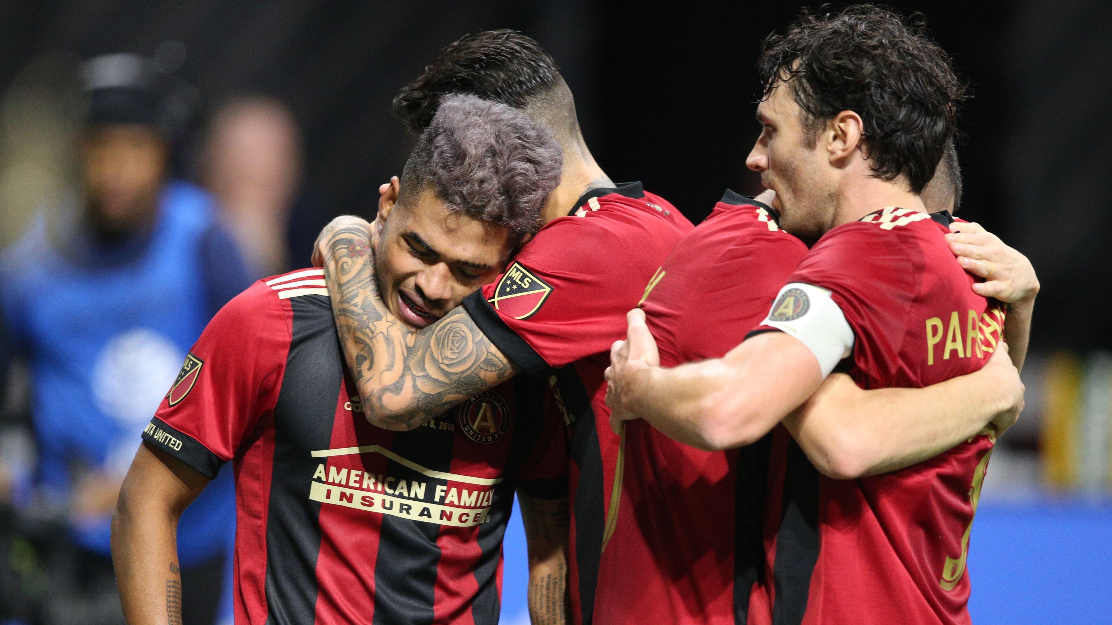 Atlanta United team mates congratulate Atlanta United forward Josef Martinez (7) after he scored a goal in the first half, including Michael Parkhurst (right). The Atlanta United soccer team plays the Portland Timbers for the MLS Cup, the championship game of the Major League Soccer League at Mercedes-Benz Stadium in Atlanta. CURTIS COMPTON / CCOMPTON@AJC.COM