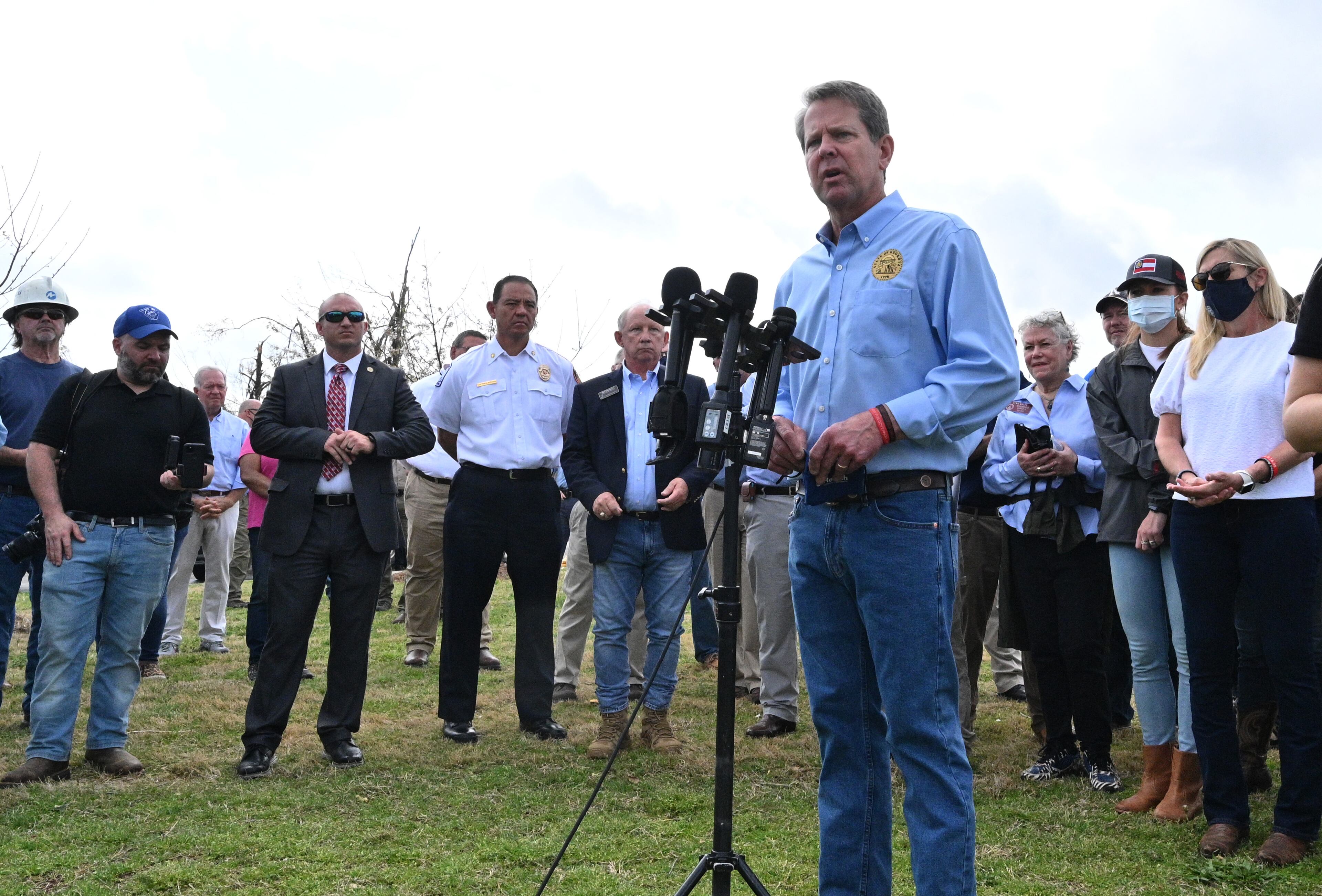 Georgia Gov. Brian Kemp speaks to the media outside Newnan High School on Saturday, March 27, 2021 in the aftermath of the tornado that tore through Newnan on late Thursday night into Friday. Most of metro Atlanta was spared from major damage, but Bartow and Polk counties - in northwest Georgia - and Coweta County south of Atlanta took the brunt of the impact. Late Friday, the National Weather Service said it was an EF4 tornado with 170-mph winds that hit Coweta. (Hyosub Shin / Hyosub.Shin@ajc.com)