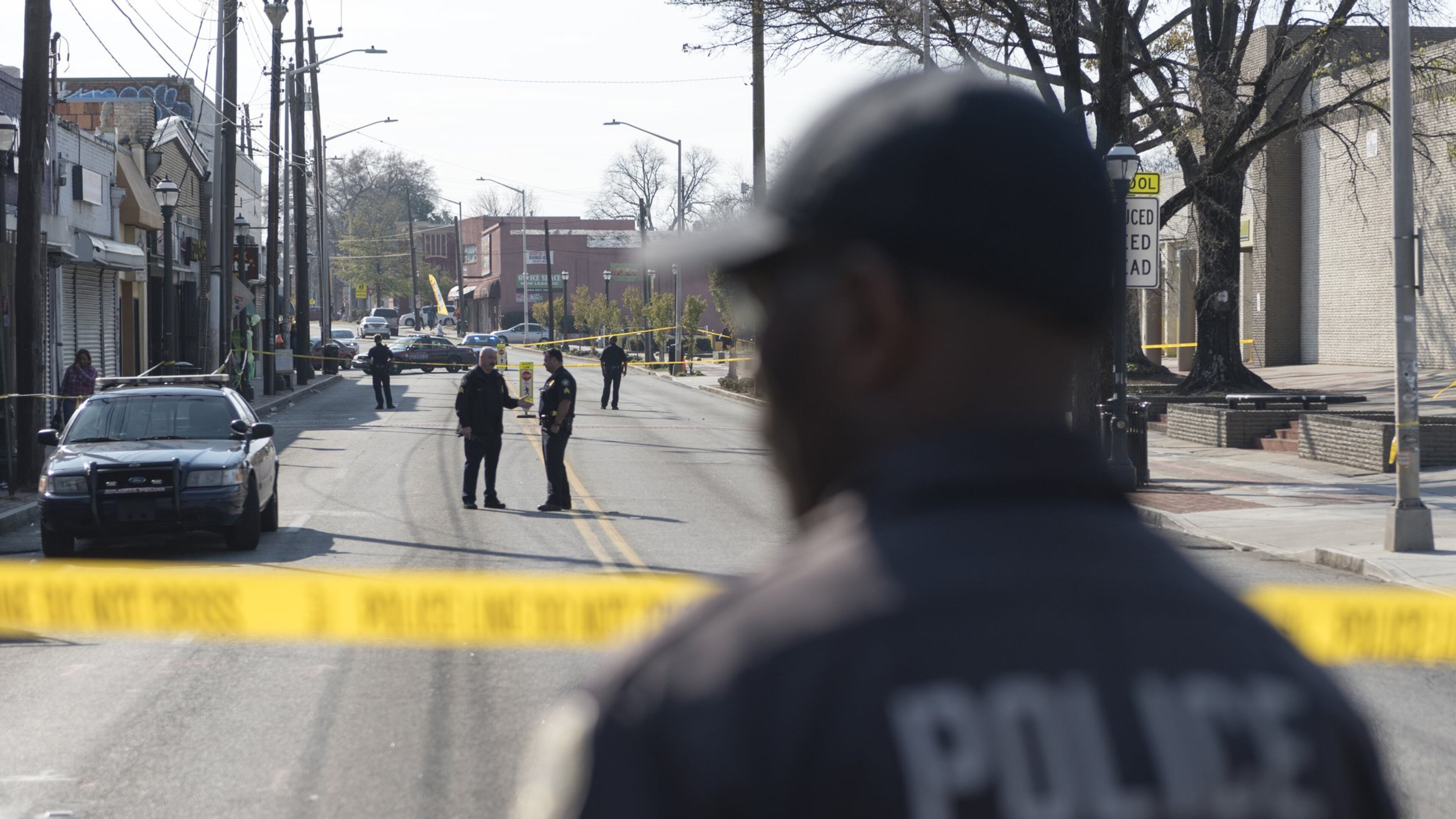 Police block off a section of Ralph David Abernathy Boulevard after a shooting at West End mall in Atlanta on Friday. (DAVID BARNES / SPECIAL)