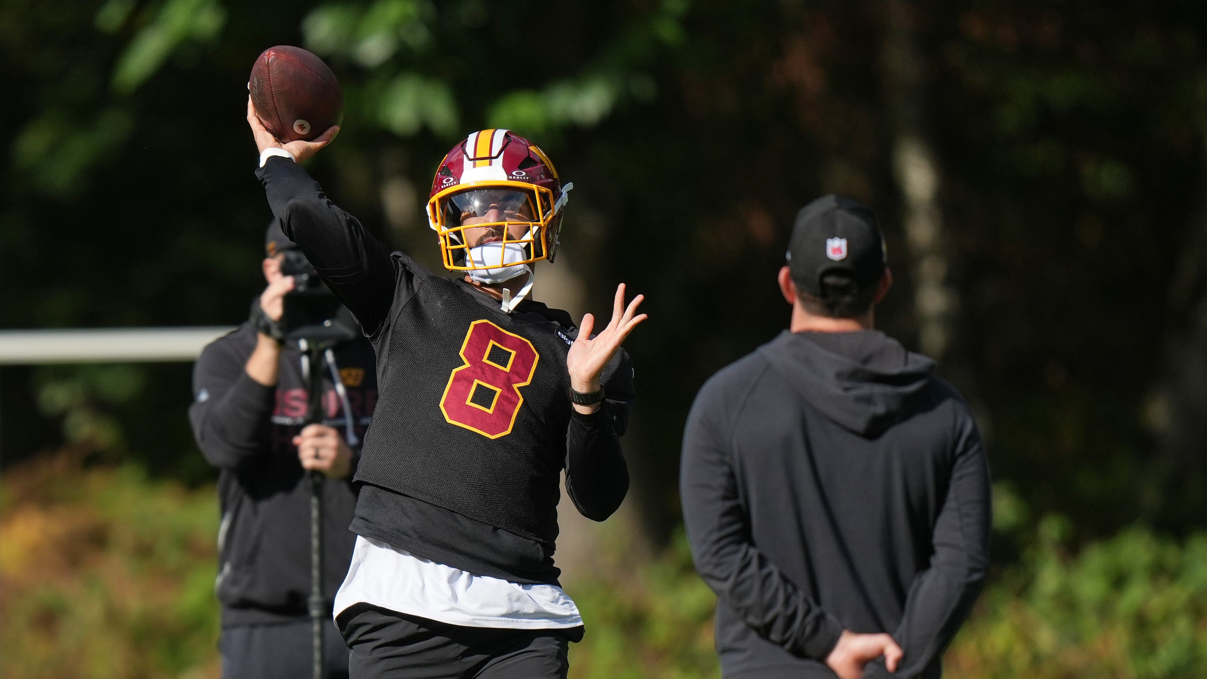 Washington Commanders' quarterback Marcus Mariota throws the ball during an NFL football practice in Hertfordshire, England, Friday, Oct. 2, 2026. (AP Photo/Alastair Grant)