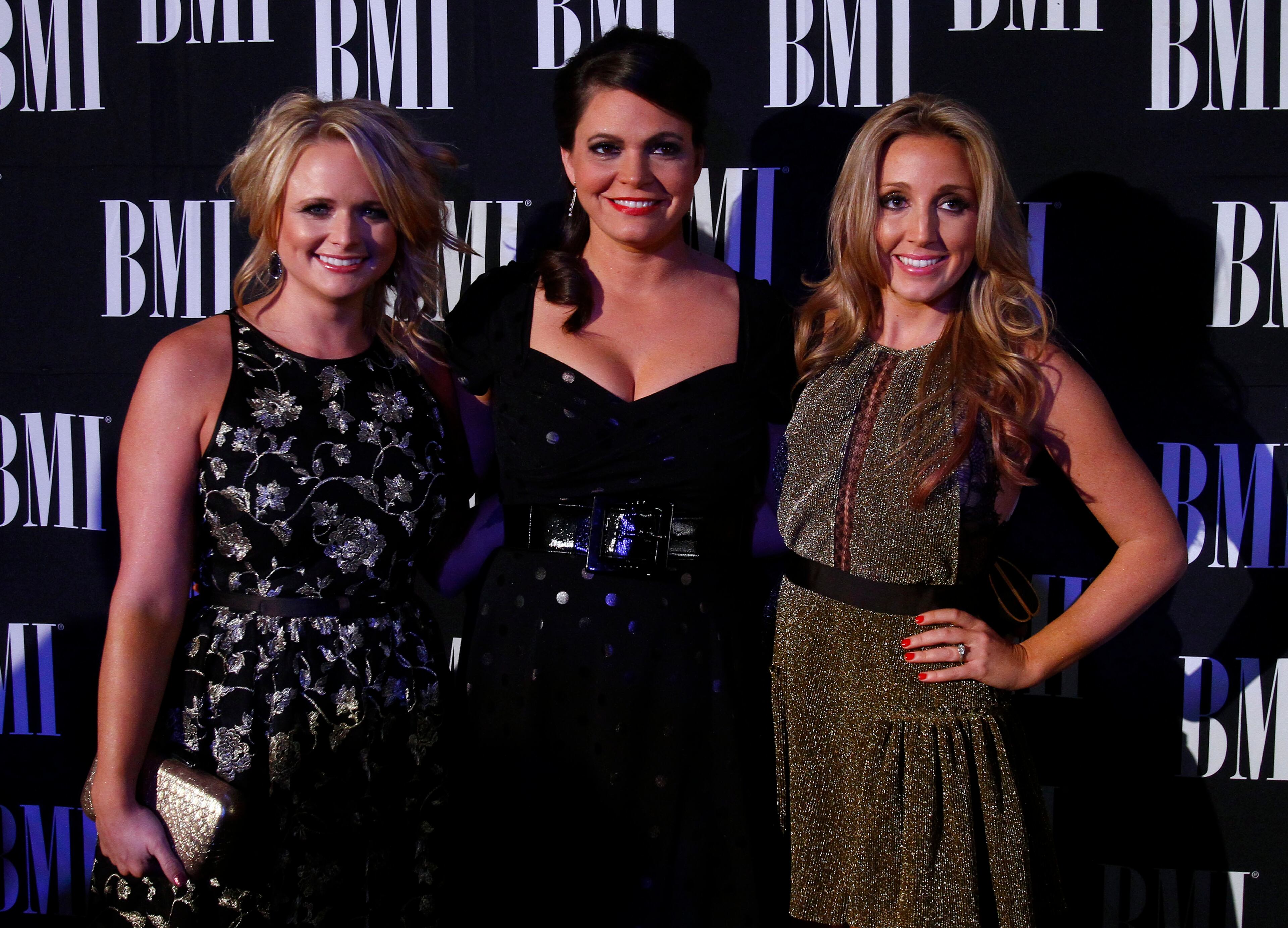 Miranda Lambert, left, Angaleena Presley, center, and Ashley Monroe of the Pistol Annies arrive at the 60th Annual BMI Country Awards.