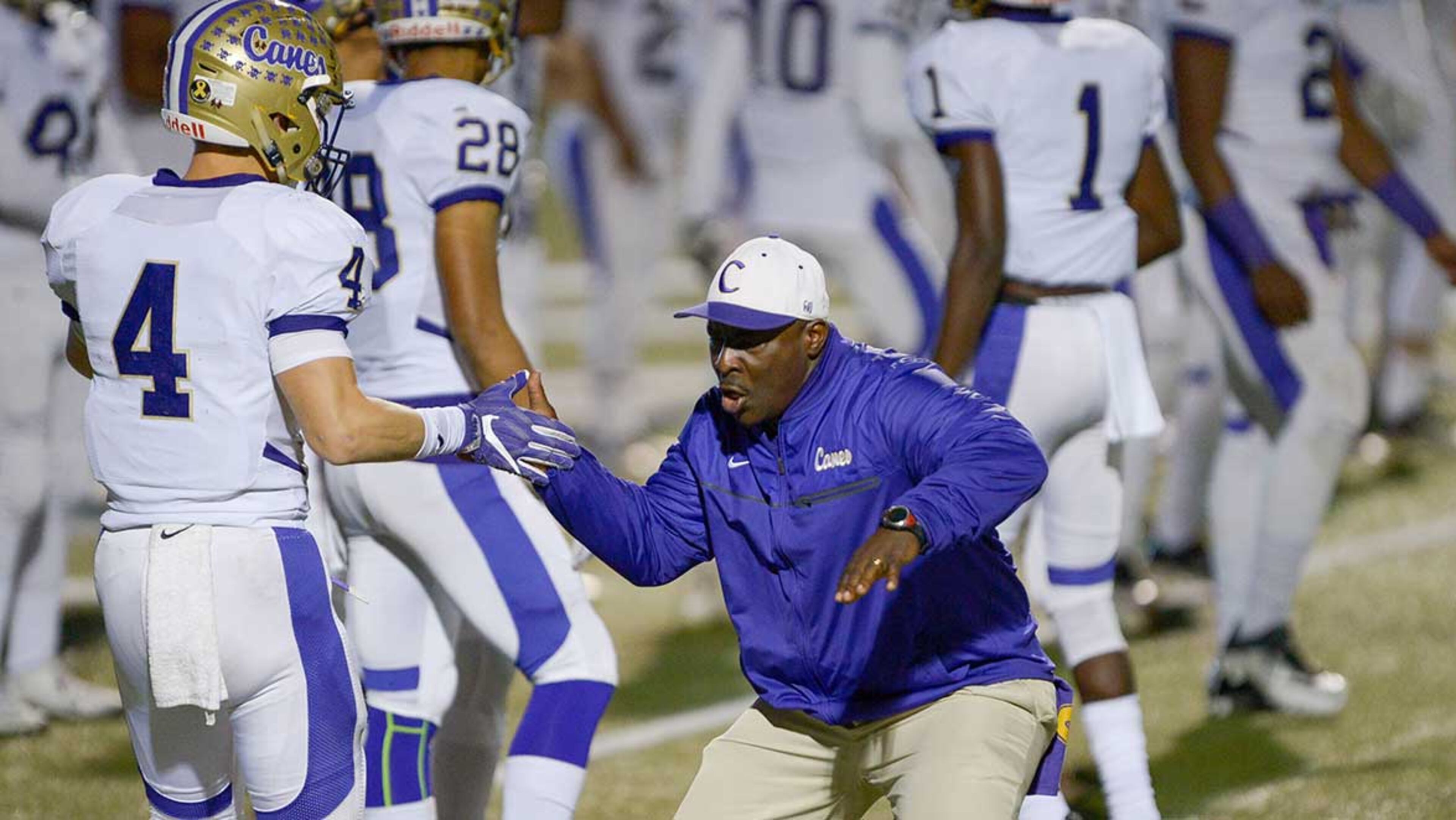 Cartersville OLB coach Cedric Ward gets the team fired up as they prepare for Friday's game at Woodward Academy.