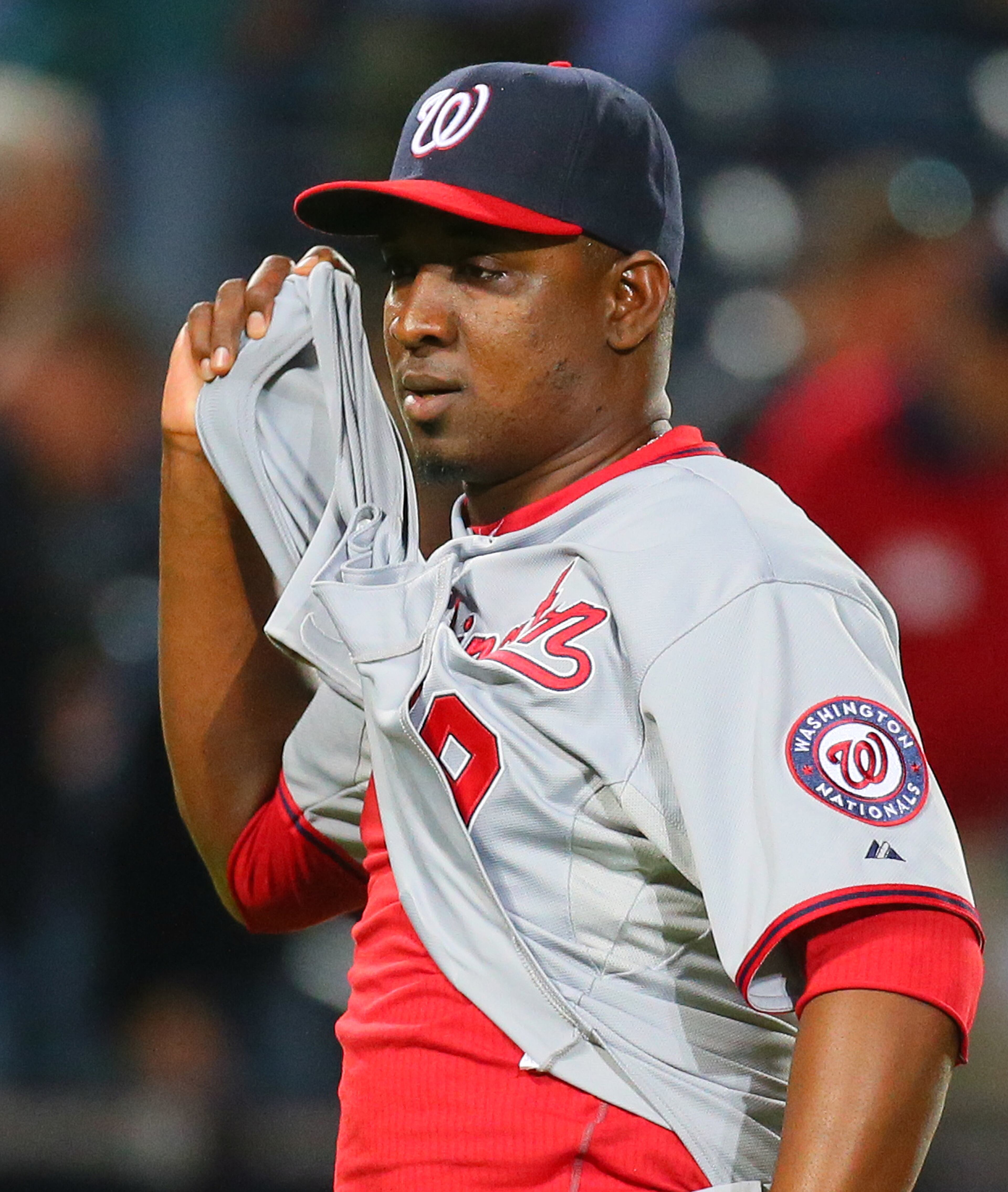 Nationals closer Rafael Soriano rips open his jersey. celebrating beating the Braves 2-0.