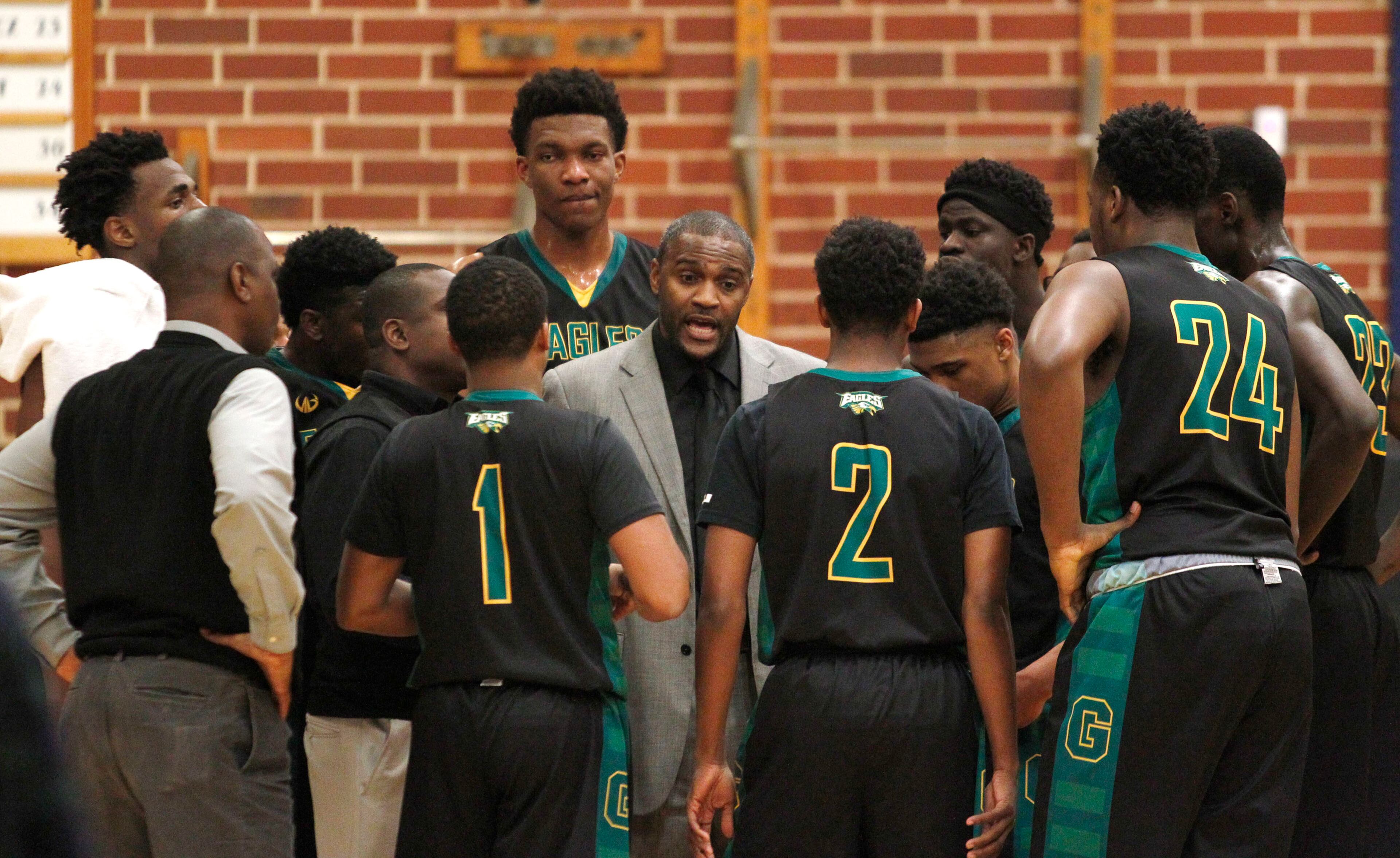 Greenforest Christian head coach Larry Thompson (C) talks to his players before their game against Landmark Christian at a high school basketball game at Landmark Christian school Friday, February 5, 2016. TAMI CHAPPELL/SPECIAL TO THE AJC