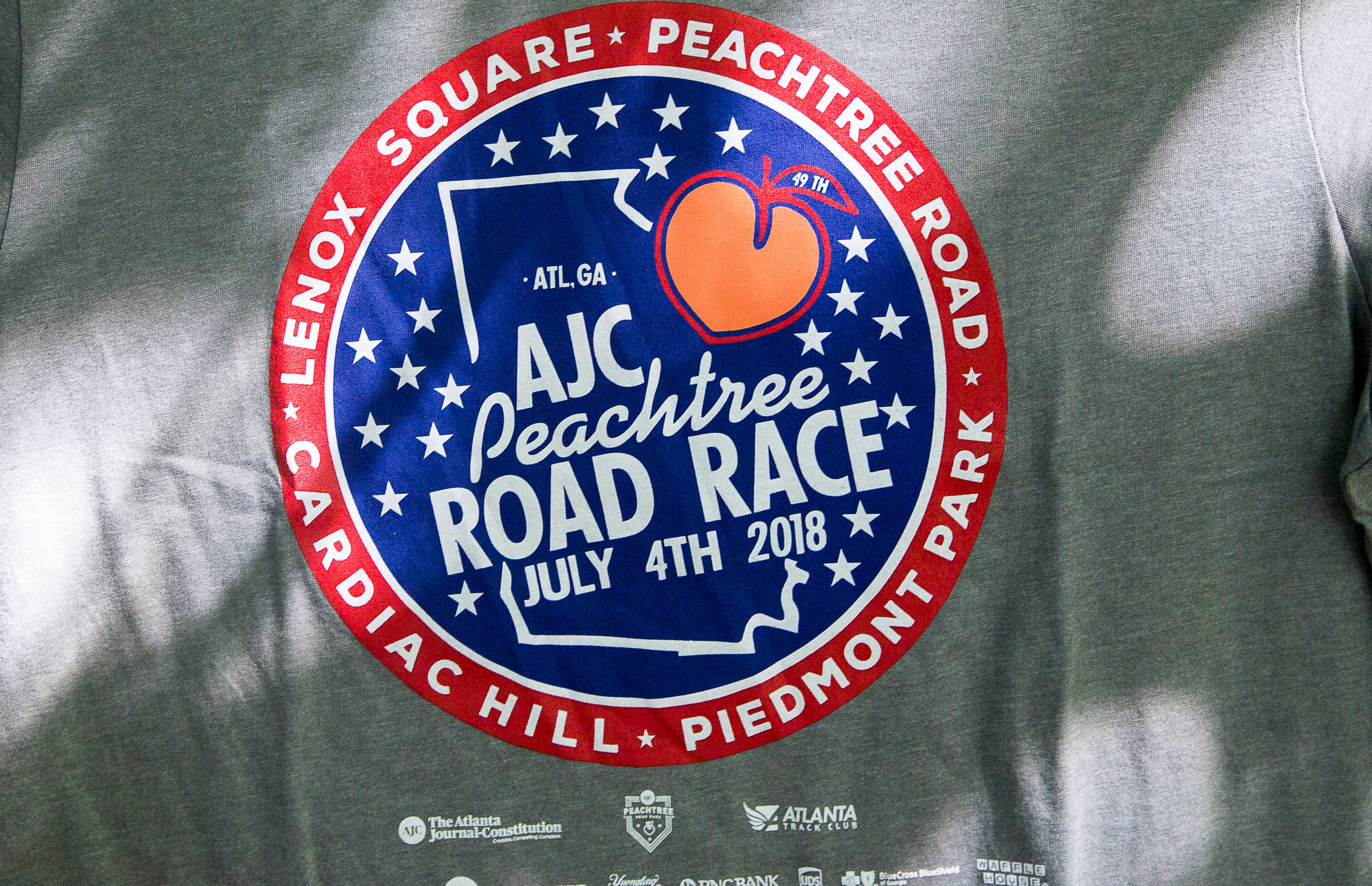 07/03/2018 -- Atlanta, GA - The official 2018 Peachtree Road Race T-shirt is revealed at the Park Tavern, Tuesday, July 3, 2018. ALYSSA POINTER/ALYSSA.POINTER@AJC.COM