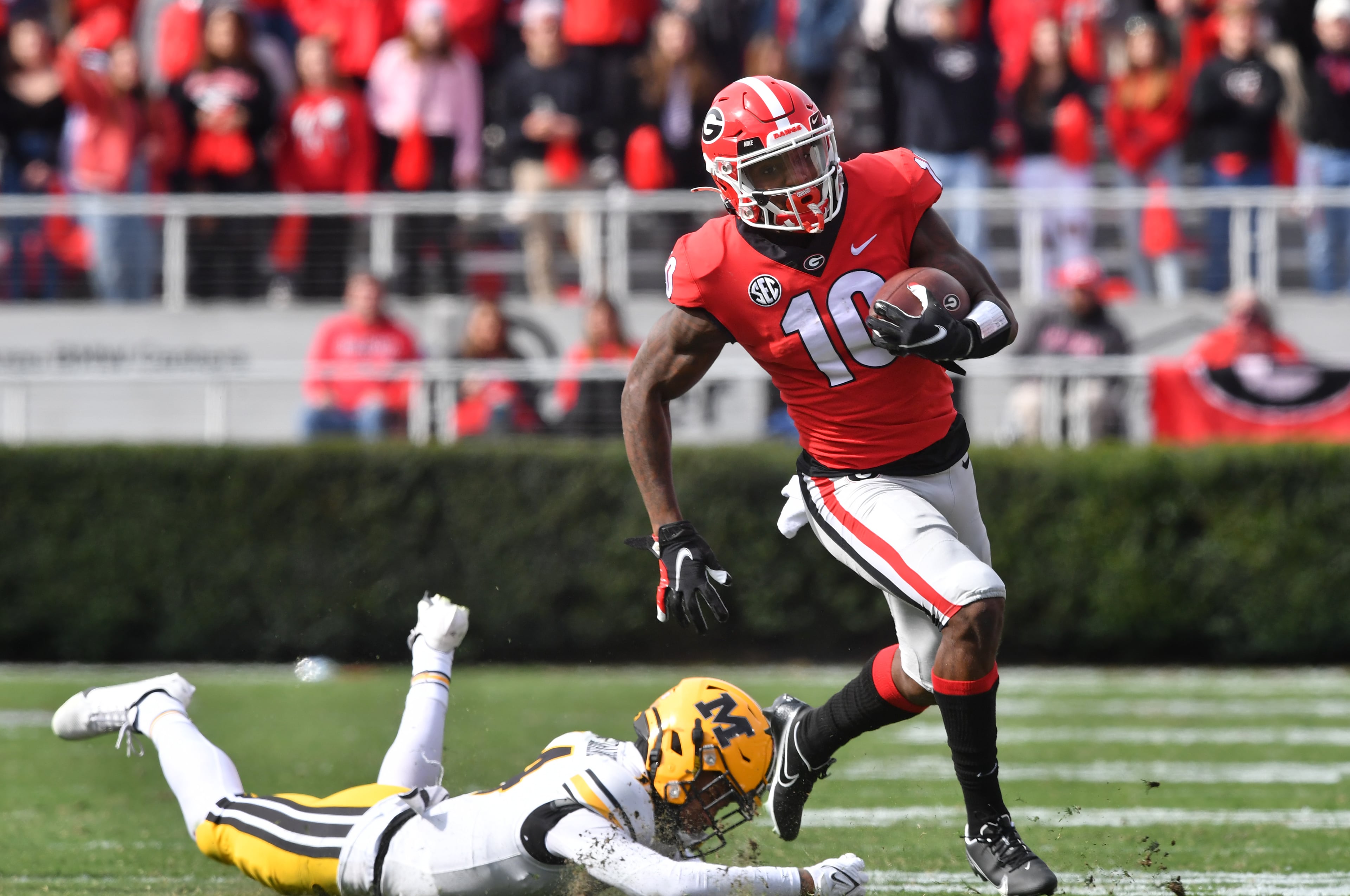 Georgia's wide receiver Kearis Jackson (10) eludes a tackle by Missouri's defensive back Kris Abrams-Draine (14) in the second half during a NCAA football game at Sanford Stadium in Athens on Saturday, November 6, 2021. Georgia won 43-6 over Missouri. (Hyosub Shin / Hyosub.Shin@ajc.com)