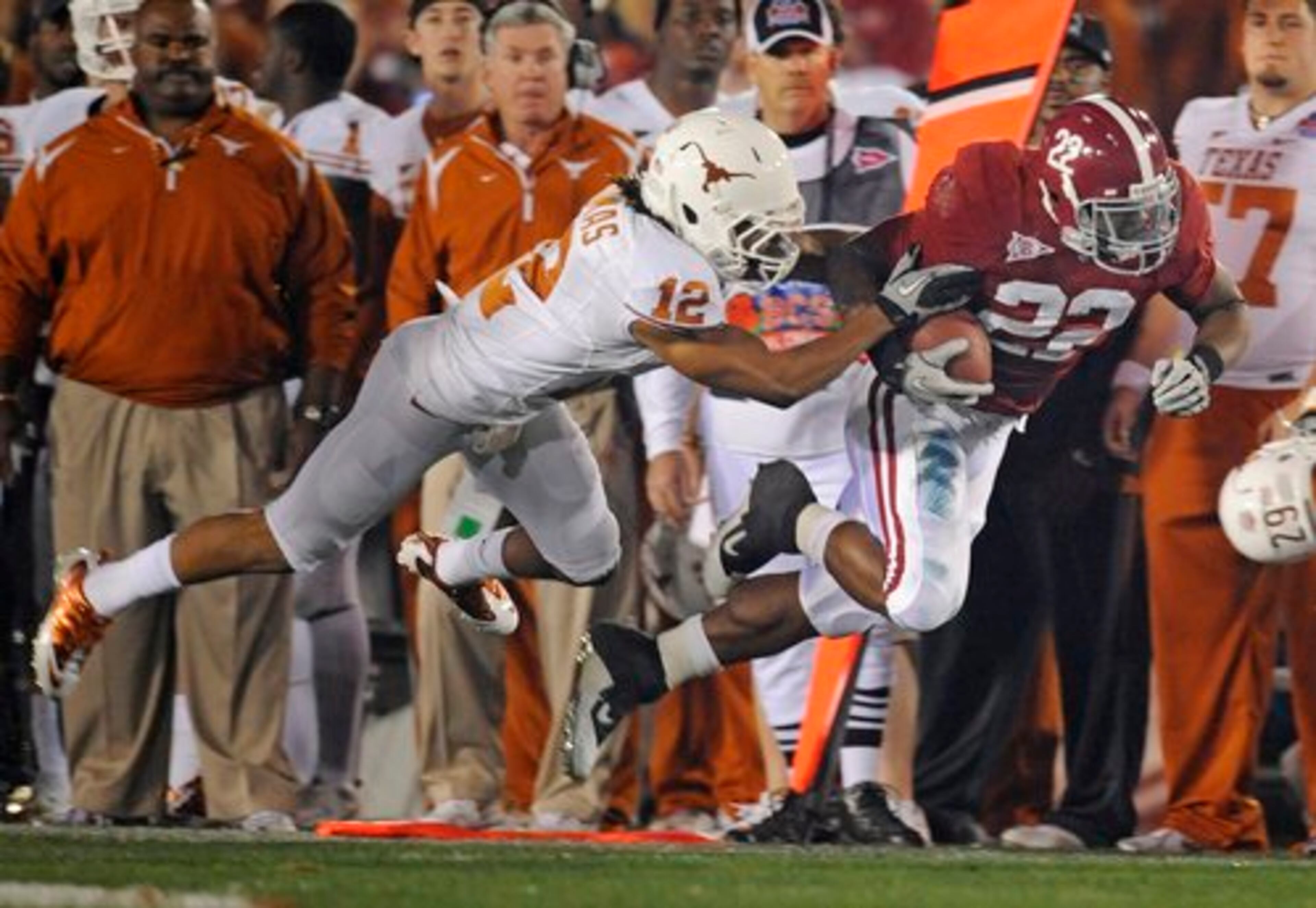 Texas safety Earl Thomas (left) chases down Alabama running back Mark Ingram.