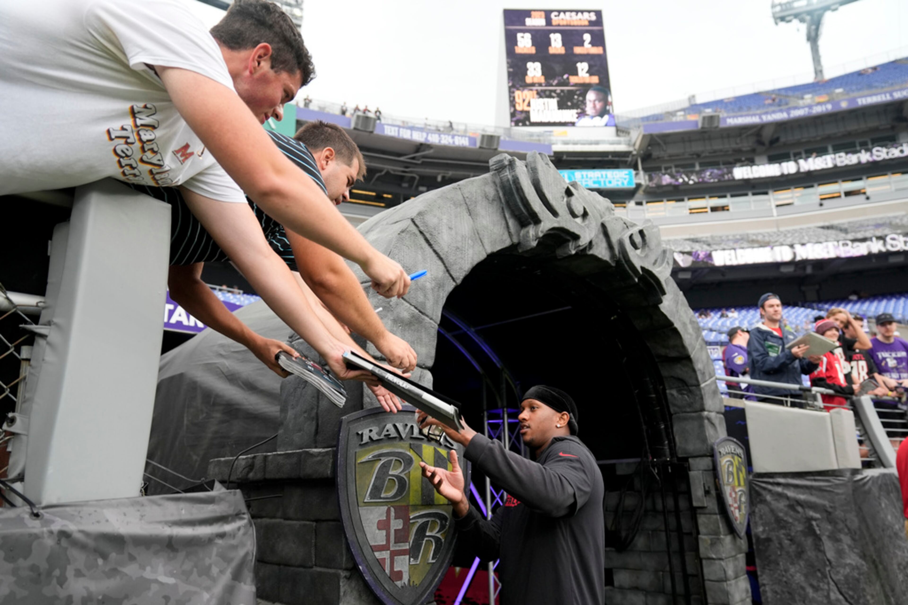 Atlanta Falcons quarterback Michael Penix Jr. signs autographs before a preseason NFL football game against the Baltimore Ravens on Saturday, Aug. 17, 2024, in Baltimore. (AP Photo/Stephanie Scarbrough)