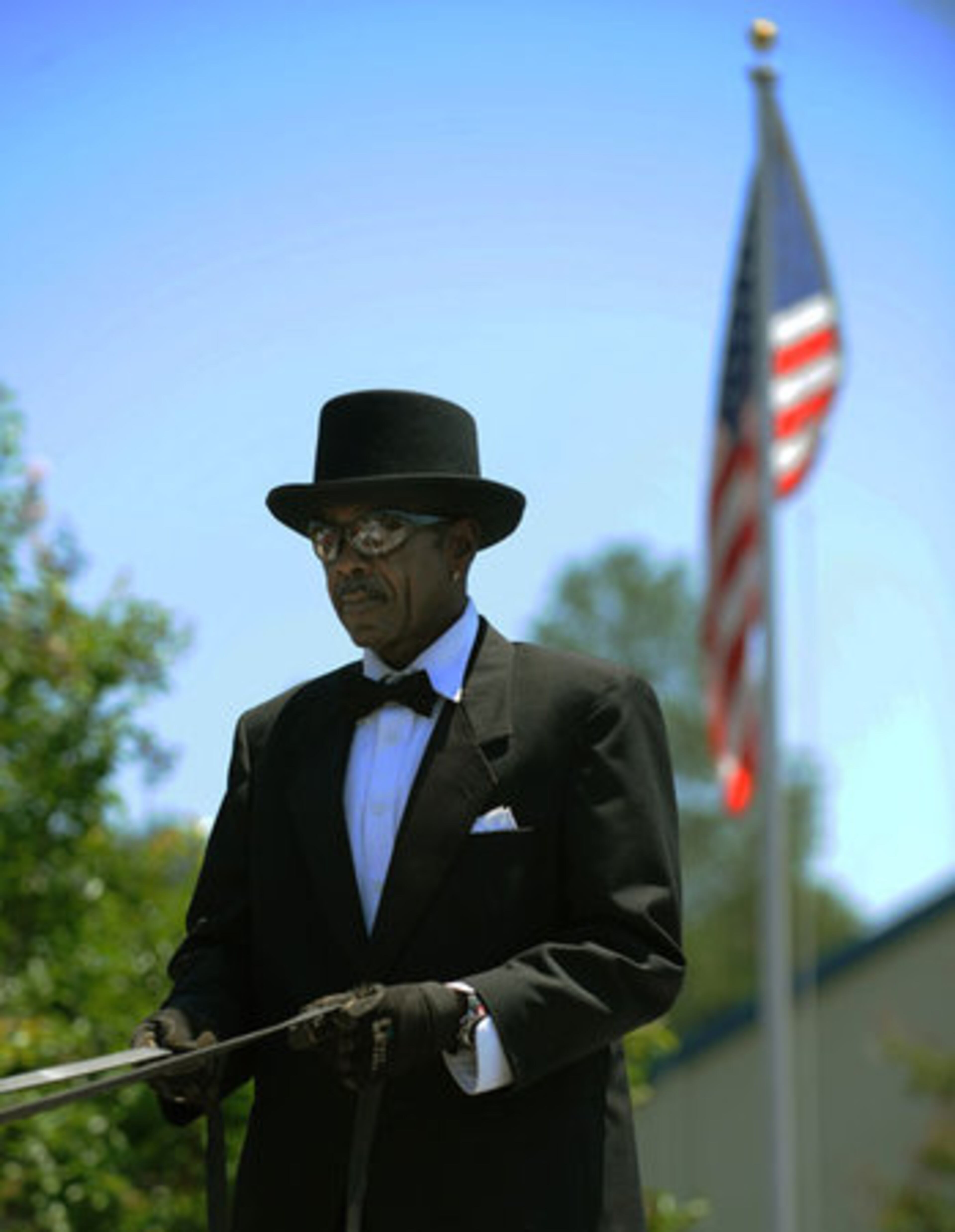 Tam Burton stands as he drives the horse drawn carriage at the memorial service for Jazmin Green.
