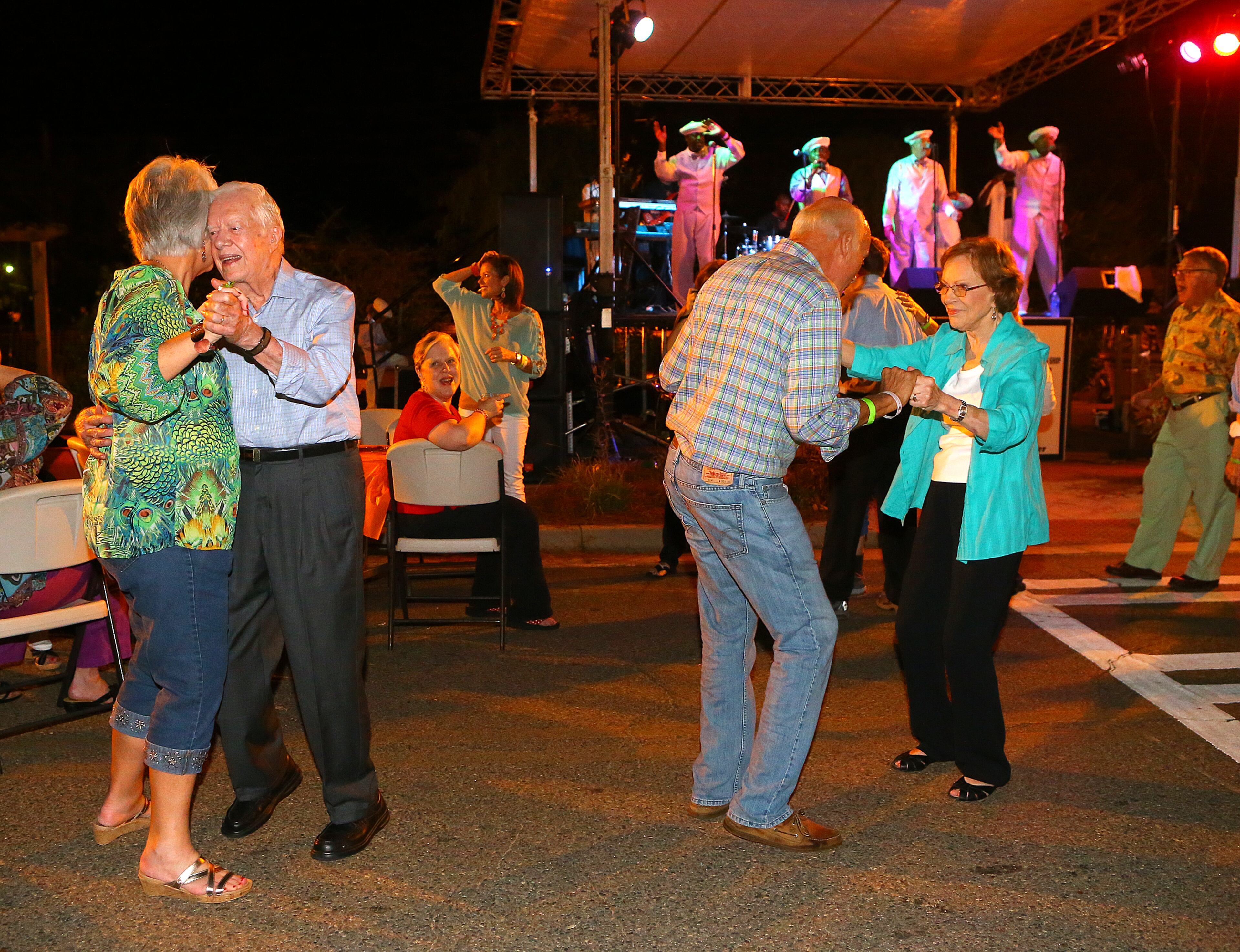 Jimmy Carter and former First Lady Rosalynn Carter join in the Festival Dance with friends and visitors to the sound of The Tams on Main Street during the 18th Annual Plains Peanut Festival on Saturday, Sept. 27, 2014, in Plains. CURTIS COMPTON / CCOMPTON@AJC.COM