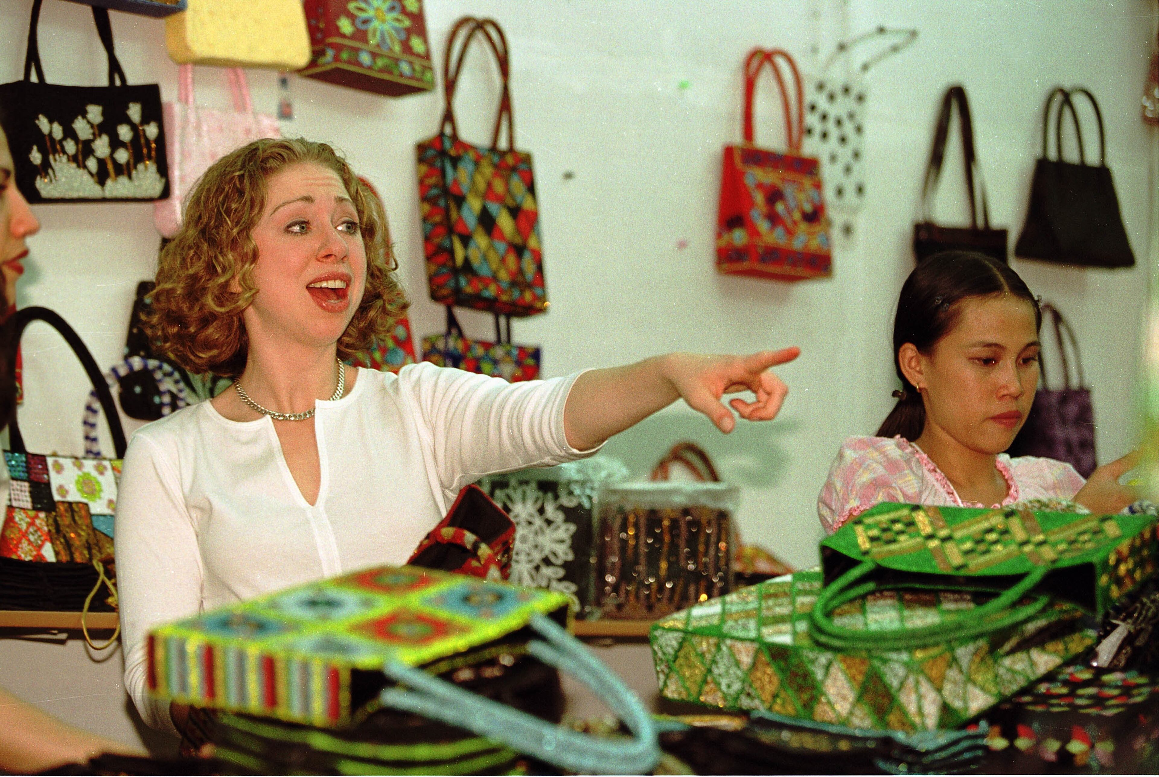 Chelsea Clinton goes on a shopping spree November 19, 2000 at a gift shop that sells beaded purses and shoes in Ho Chi Minh City, Vietnam. She bought many pieces for gifts to give to friends back home. Chelsea was traveling with her father President Bill Clinton, the first American president to visit Vietnam since the war ended in 1975, on a three-day visit to Vietnam. (Photo by Paula Bronstein/Newsmakers)