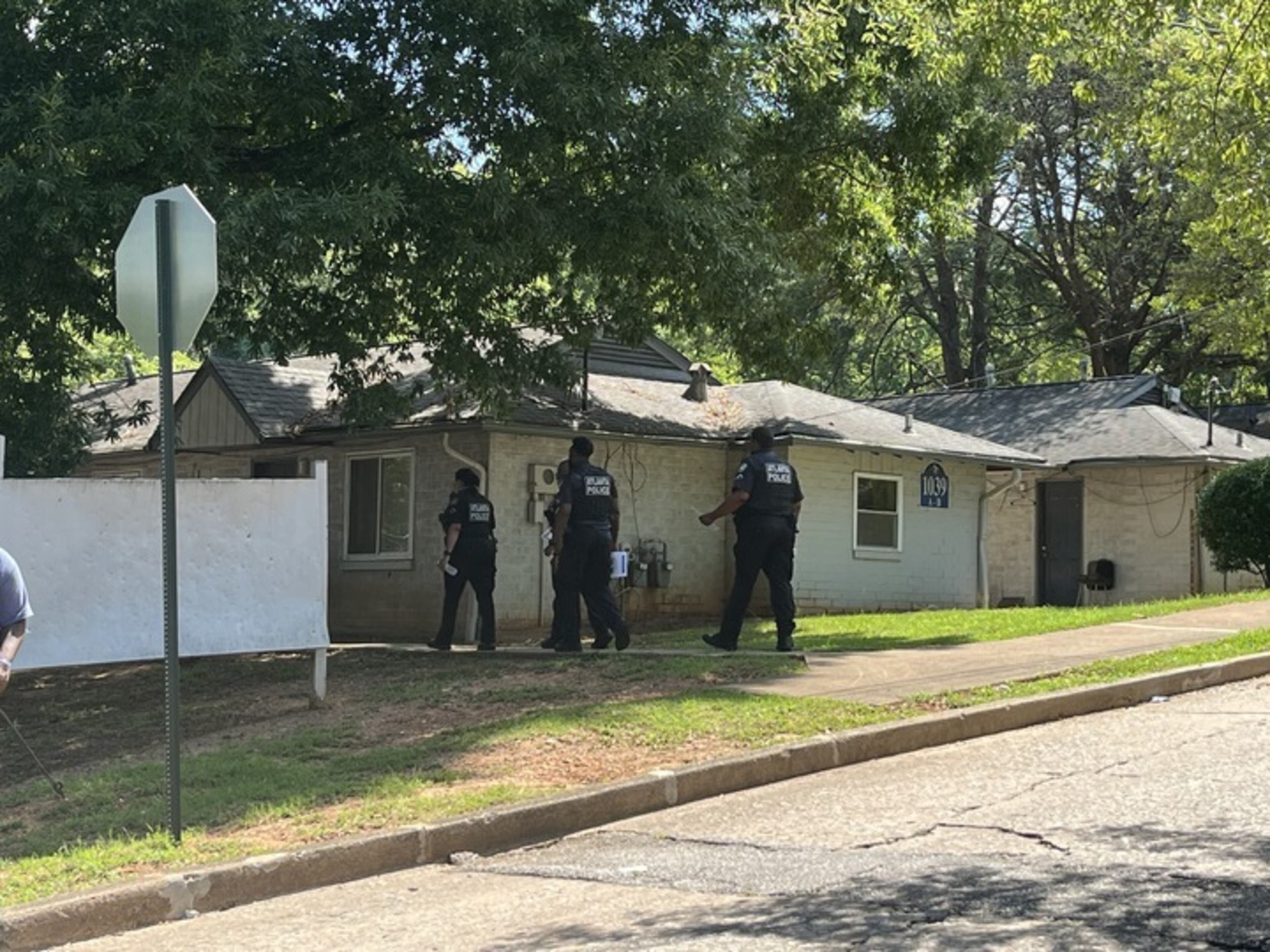Police officers spoke to locals in the area of Sparks Street in southwest Atlanta on Friday about the fatal shooting of two teenagers that happened July 2. Officials canvassed the neighborhood to raise awareness and try to learn information that could aid in the homicide investigation.