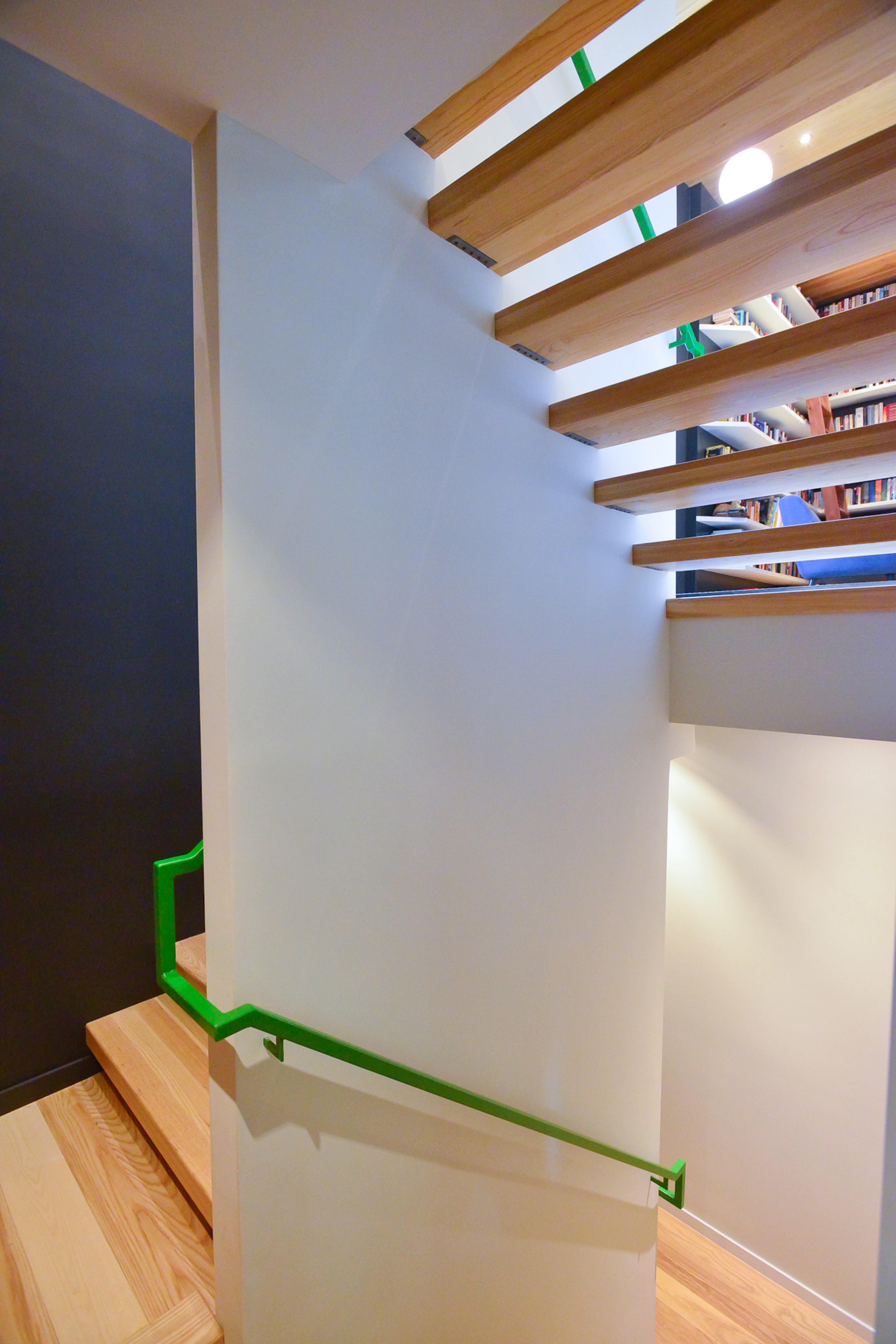 Architect Staffan Svenson of Dencity created multiple levels in the home - some separated by only a few steps. To liven up the white walls, there's a paint called Lovely Green on the interior and exterior railings.