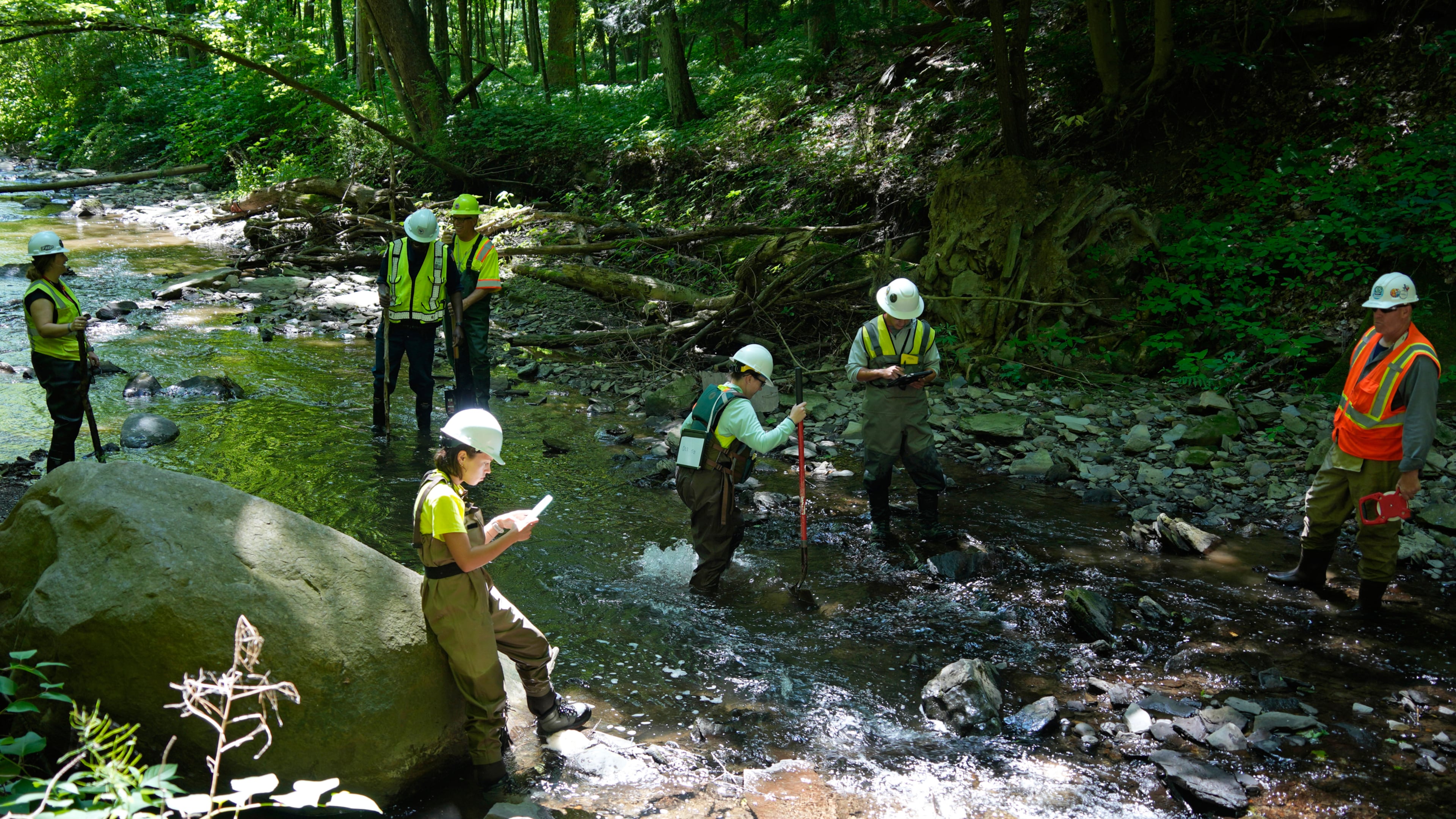 FILE - Environmental Protection Agency workers survey Leslie Run in East Palestine, Ohio, on June 12, 2024. (AP Photo/Gene J. Puskar, File)