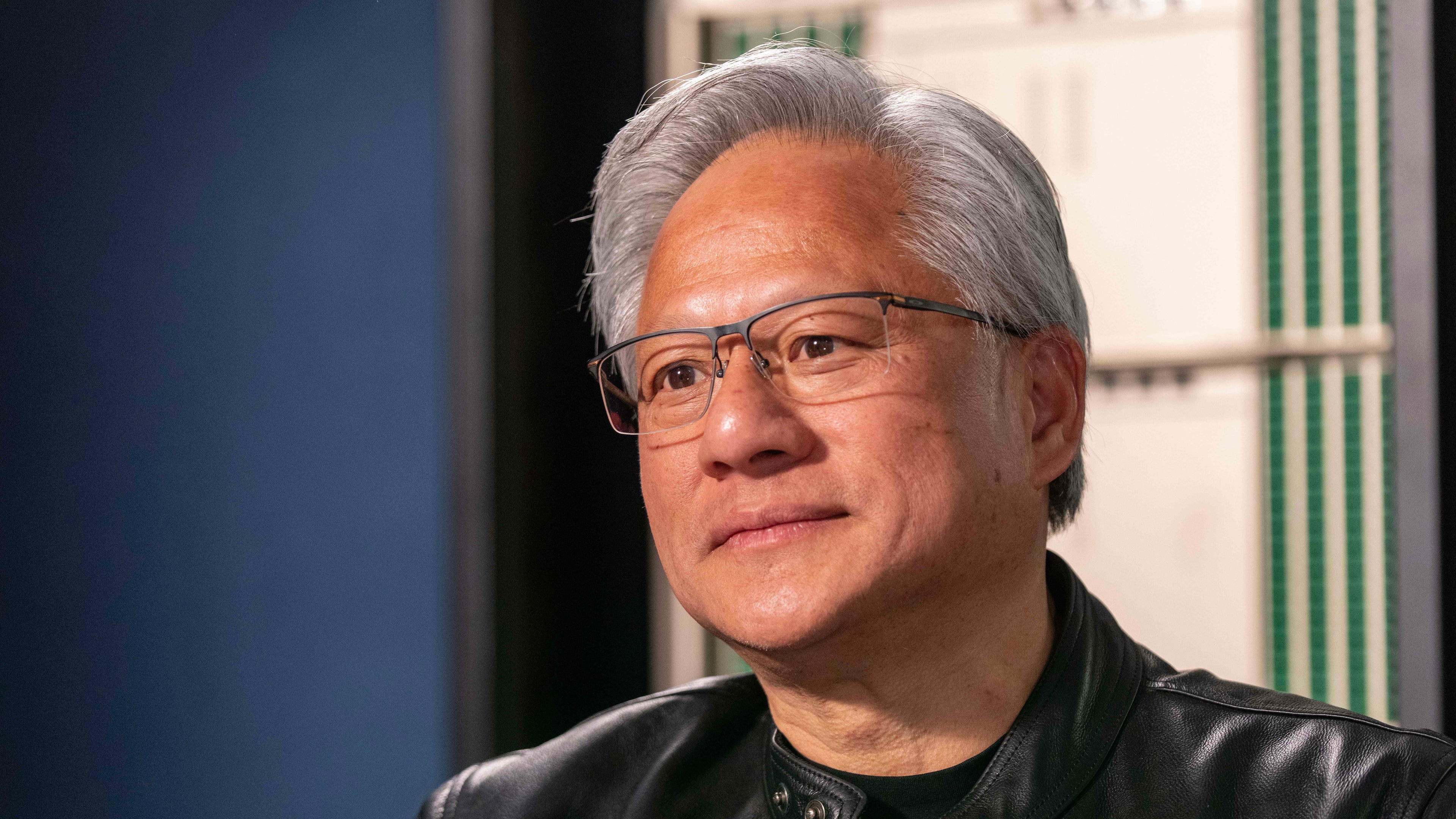 Jensen Huang, president and CEO of Nvidia, listens during an interview before a groundbreaking ceremony for an expansion of Coherent's manufacturing facility on Tuesday, June 16, 2026, in Sherman, Texas. (AP Photo/Jeffrey McWhorter)