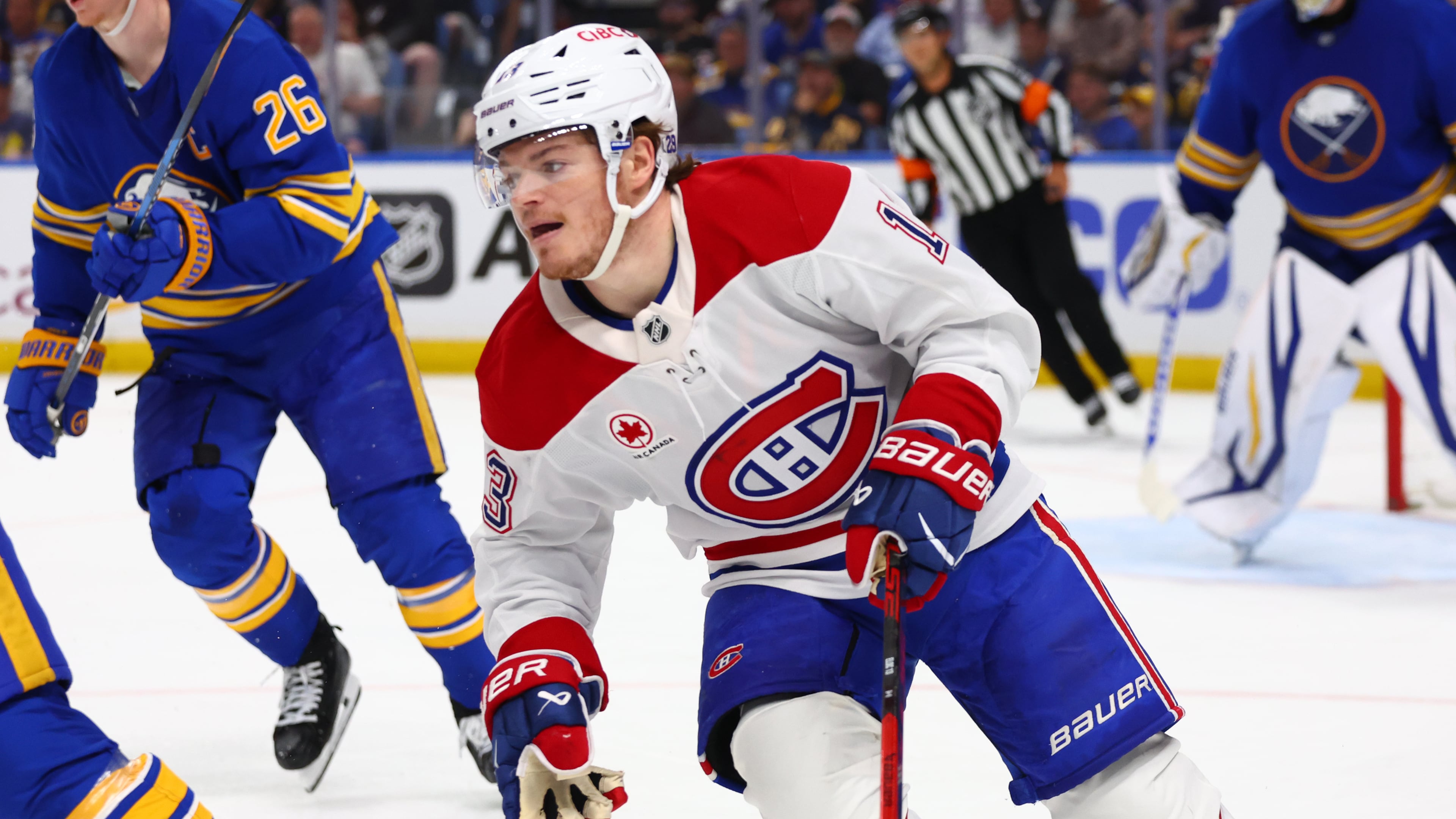 Montreal Canadiens right wing Cole Caufield, right, skates out of the zone during the second period in Game 7 of a second-round NHL hockey Stanley Cup playoff series against the Buffalo Sabres Monday, May 18, 2026, in Buffalo, N.Y. (AP Photo/Jeffrey T. Barnes)