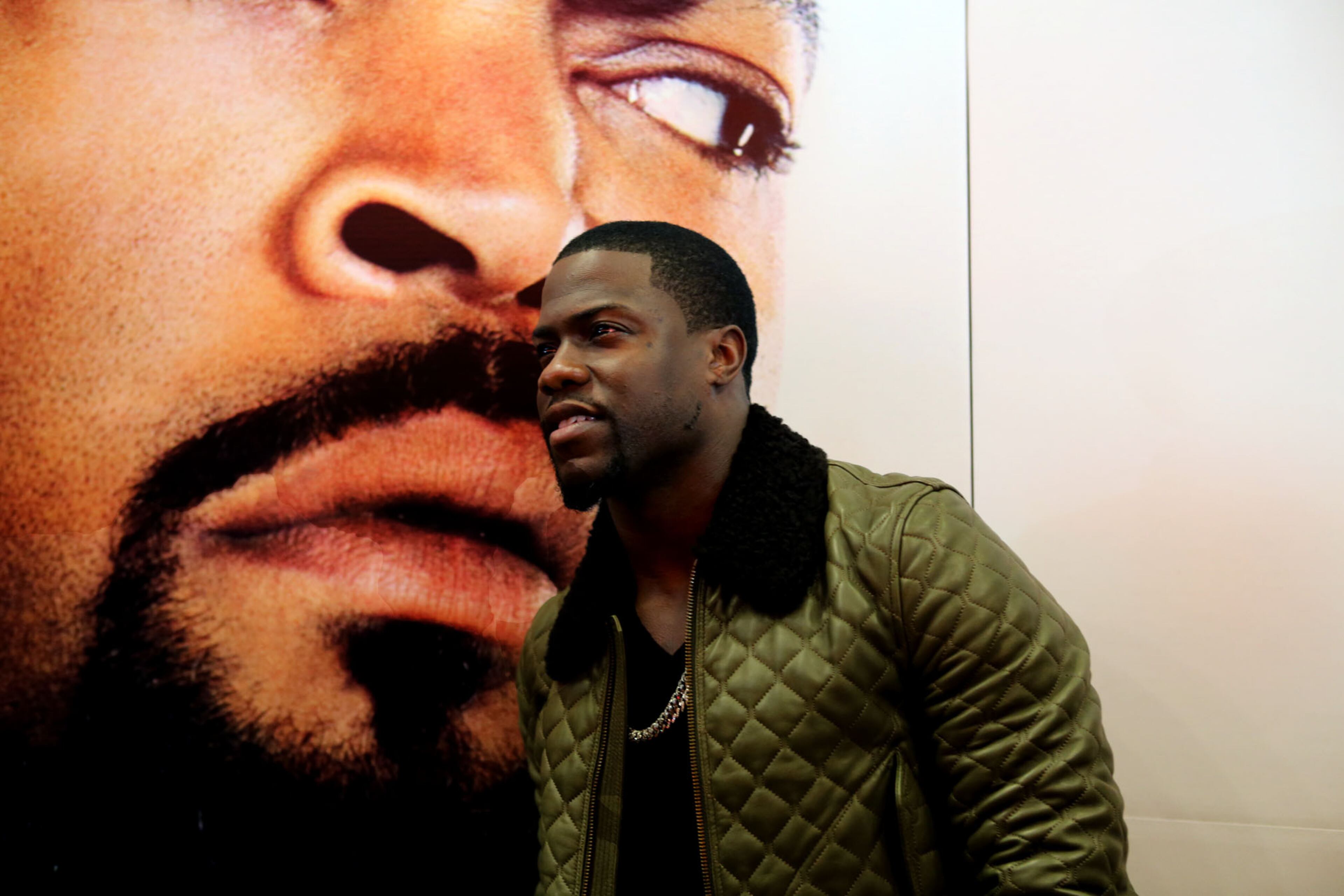 Star Kevin Hart poses on the red carpet for the premier of comedy action film "Ride Along," at the Atlantic Station Regal Theater in Atlanta Monday, Jan. 6, 2014.