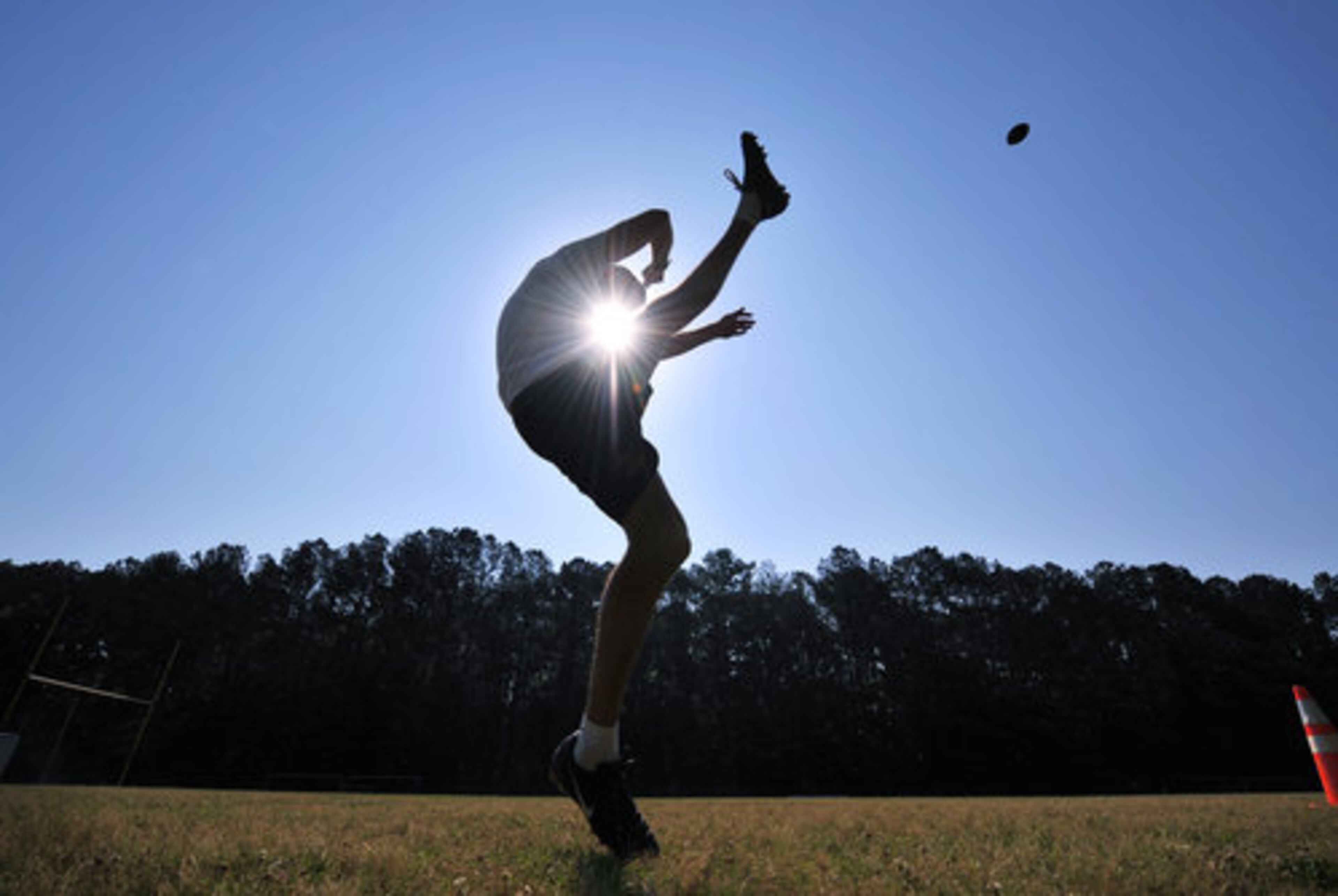 It may not be the first day of summer yet but try telling that to Chase Sitten, who practices punting the ball in Monday's hot and cloudless sky at Atlanta's Lakeside High School where he graduated this year. Atlanta's 98 degree temperature broke a record for the day.