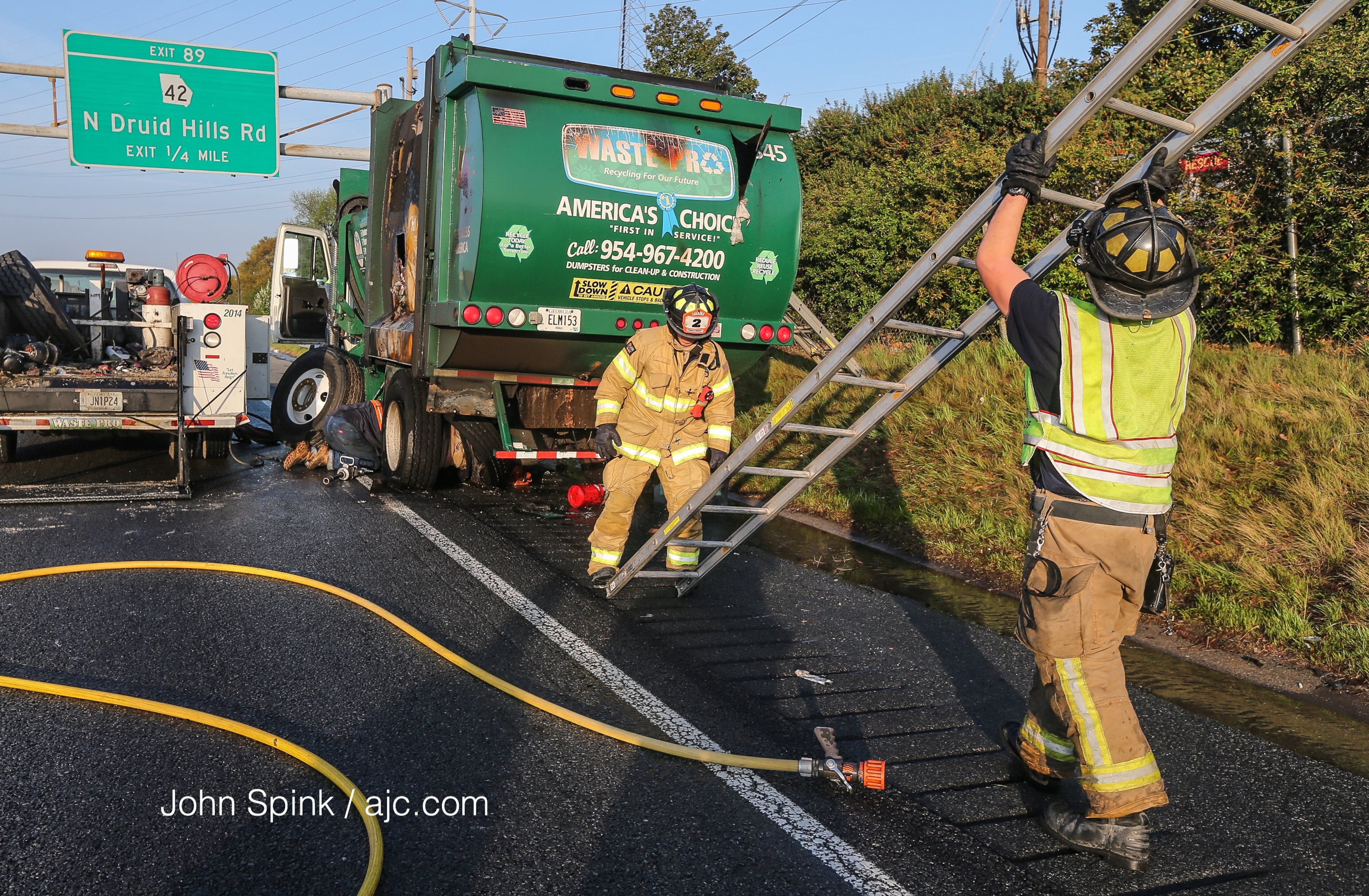 A garbage truck was involved in a crash on I-85 at North Druid Hills early Wednesday. JOHN SPINK / JSPINK@AJC.COM