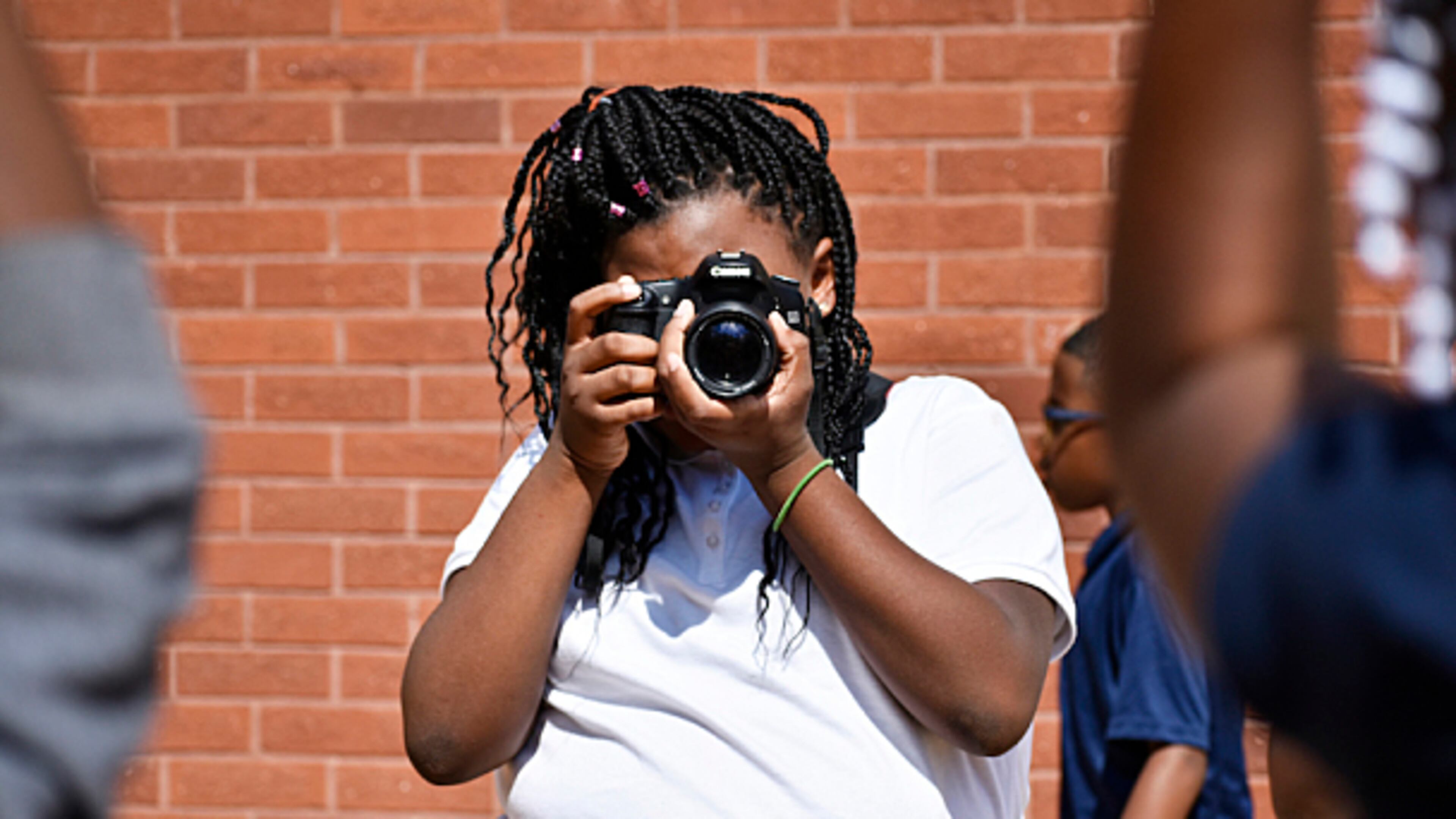 Gideons Elementary students learn the basics of photojournalism and storytelling in the Andrew P. Stewart Center's after-school program.