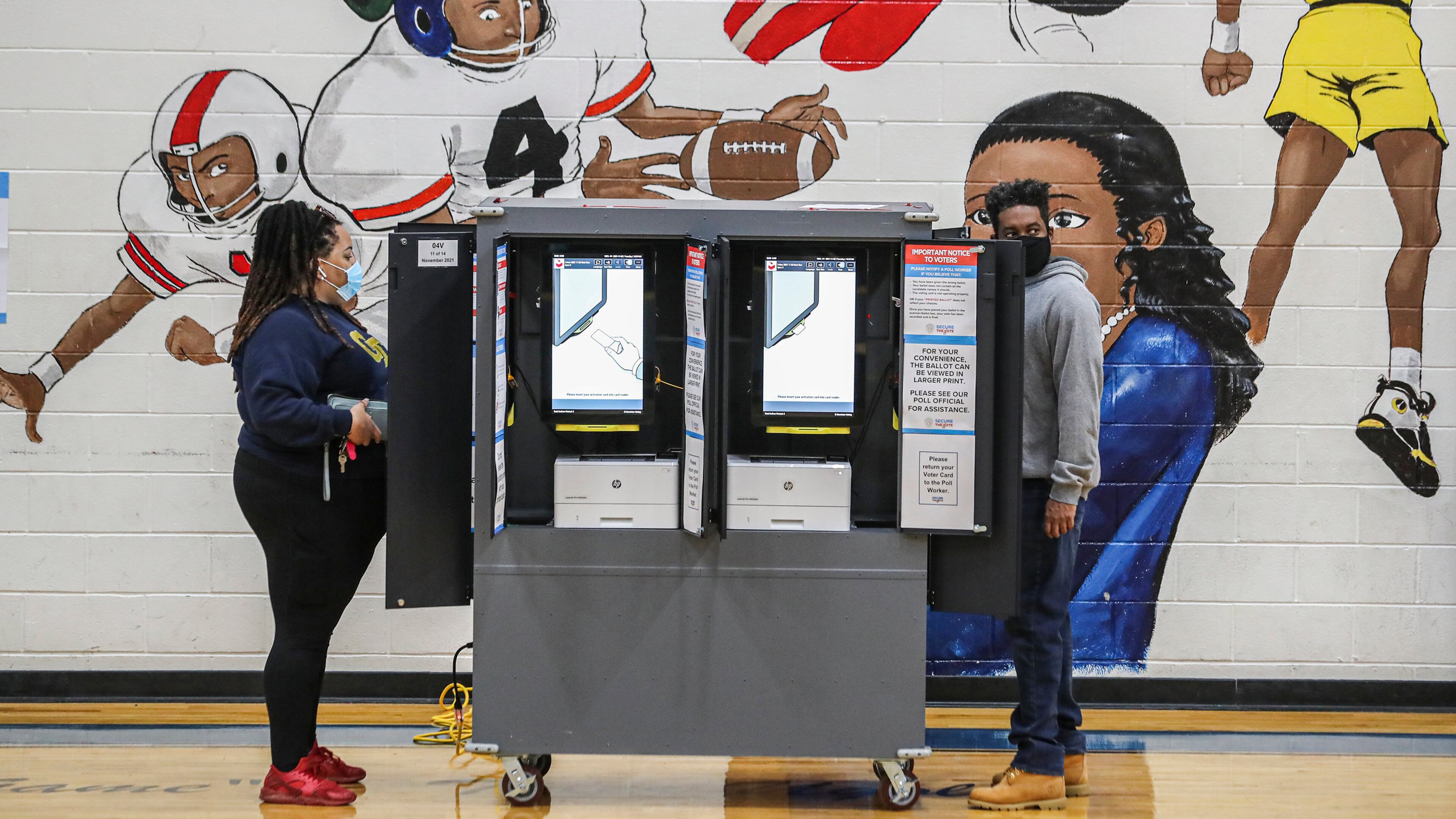 Nia James (left) and Zena Lewis (right) vote at the Dunbar Neighborhood Center in Atlanta on Tuesday, Nov. 2, 2021. (John Spink/The Atlanta Journal-Constitution/TNS)