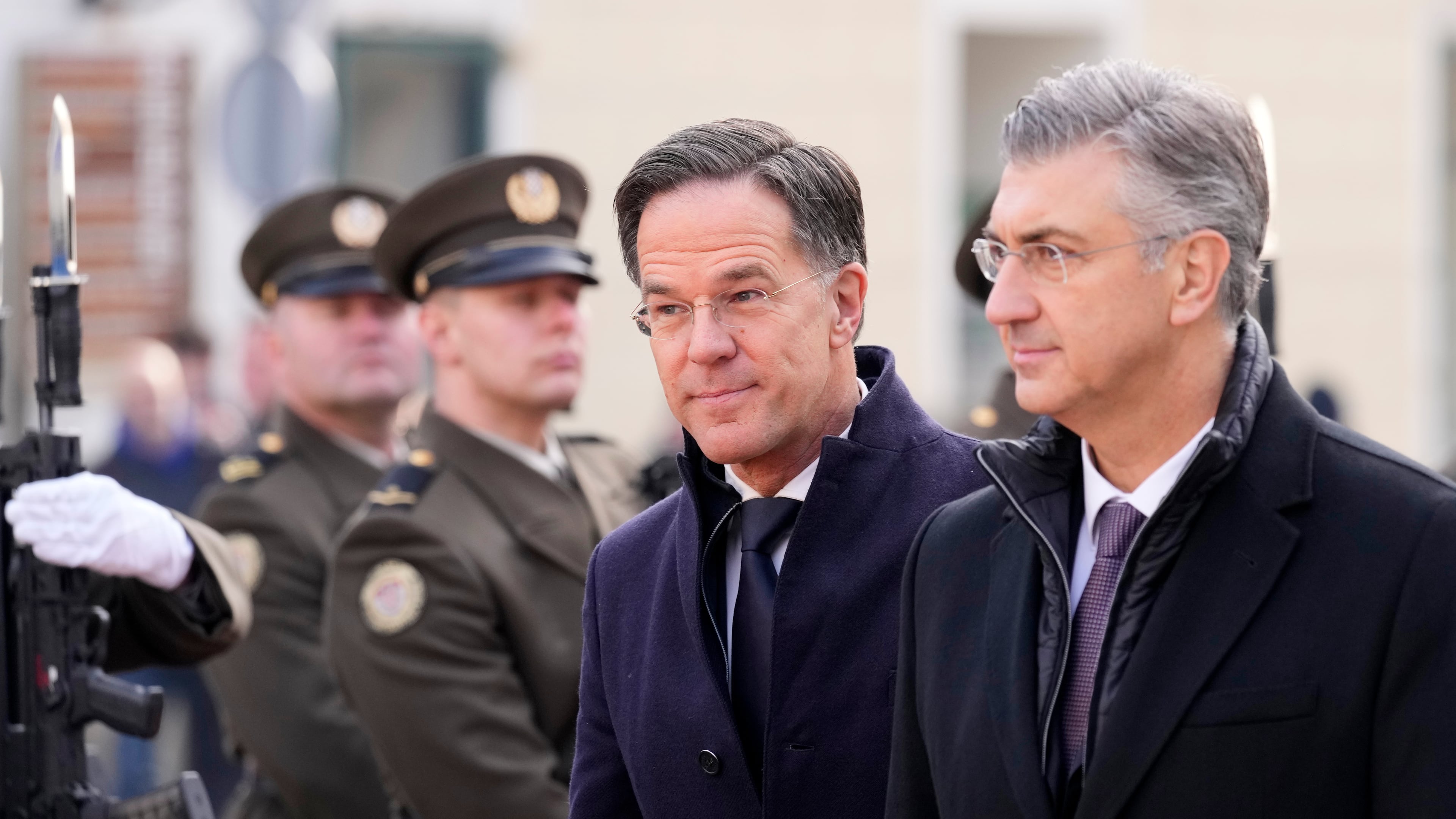 NATO Secretary General Mark Rutte, center, is welcomed by Croatian Prime Minister Andrej Plenkovic, in Zagreb, Croatia, Monday, Jan. 12, 2026. (AP Photo/Darko Bandic)