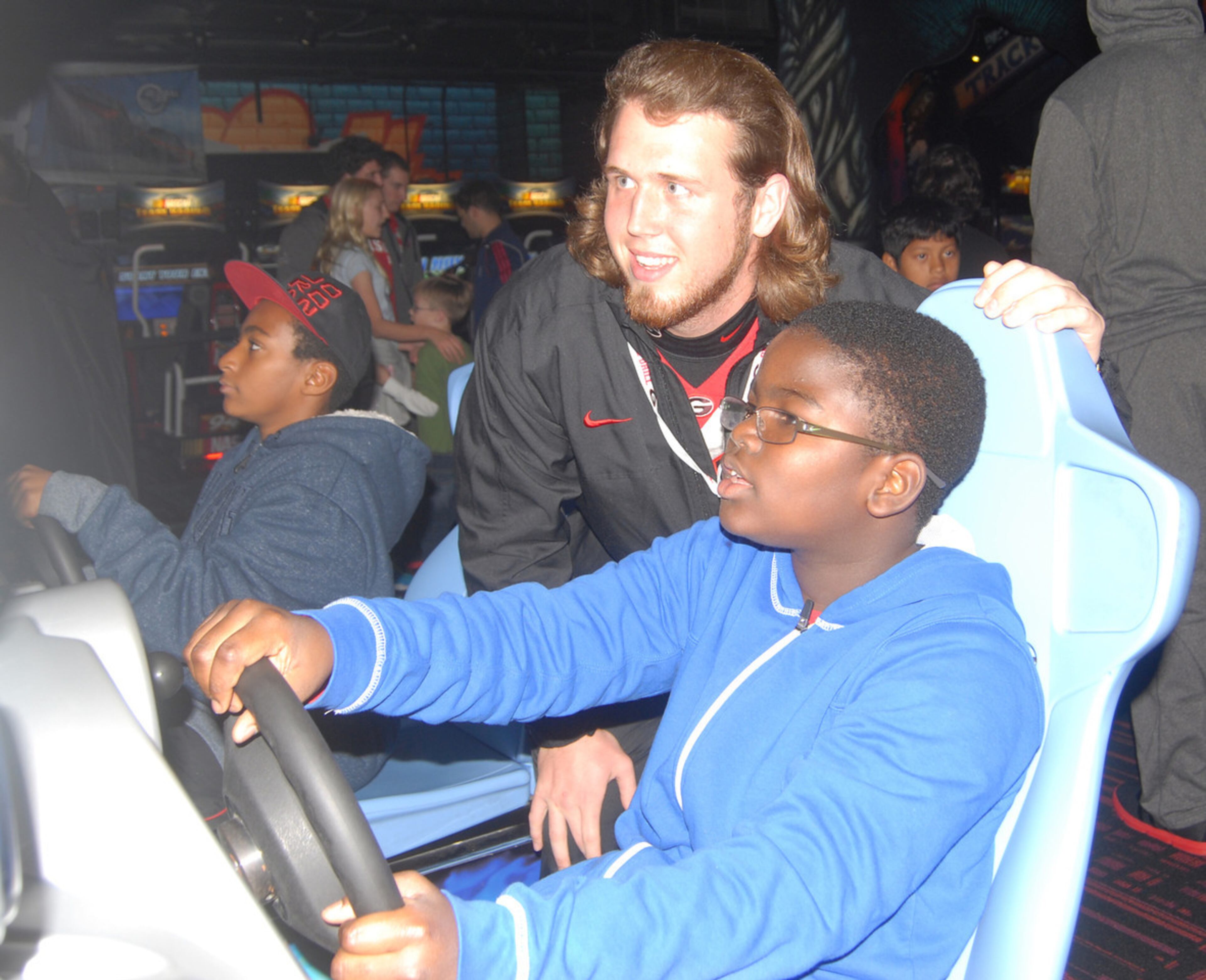 Redshirt freshman Nathan Theus gets some driving tips.