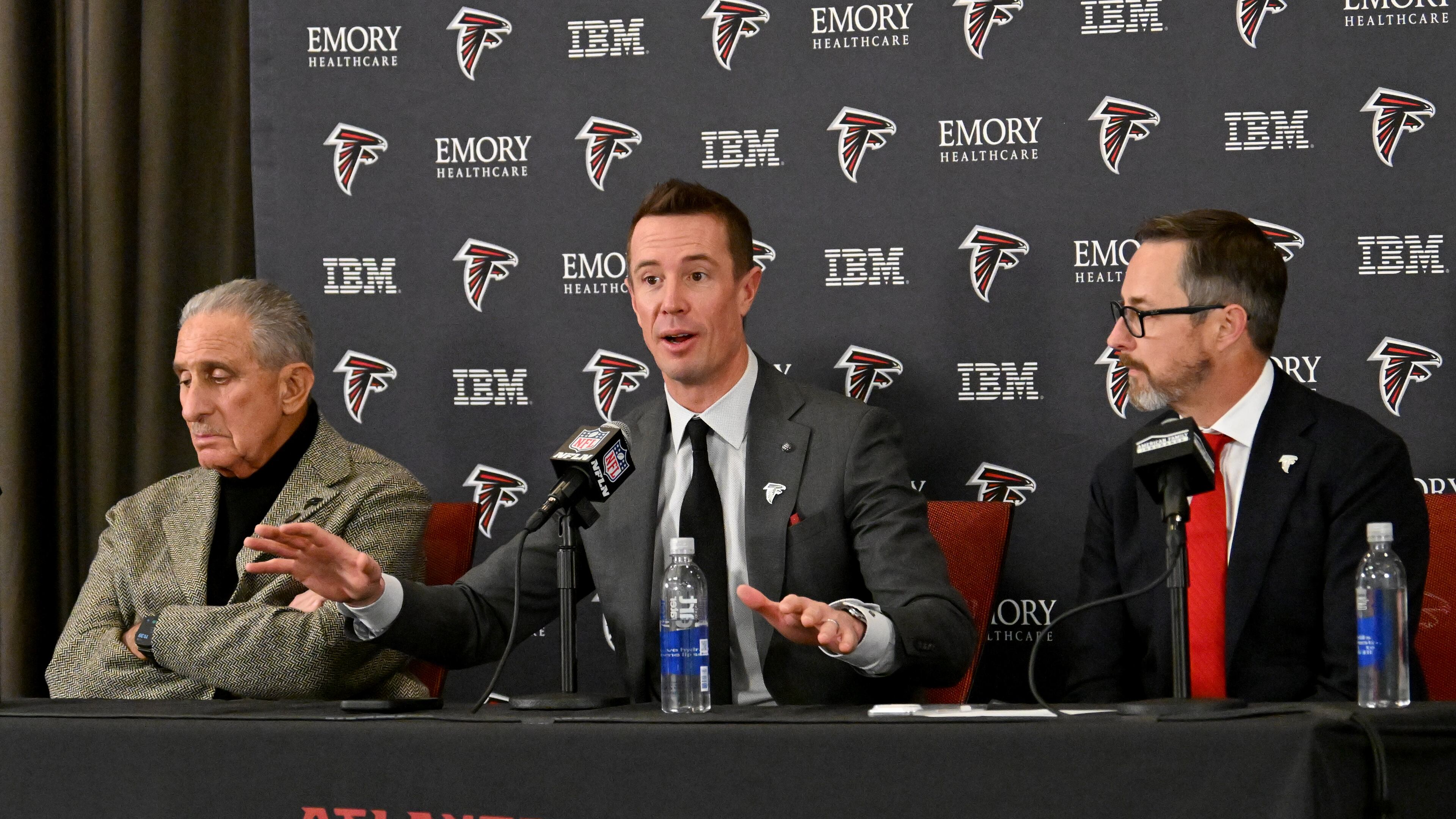 New Atlanta Falcons president of football Matt Ryan (center) speaks as Atlanta Falcons owner Arthur M. Blank (left) and CEO Greg Beadles sit next him during a news conference to introduce new Falcons president of football Matt Ryan, Tuesday, Jan. 13, 2026, in Flowery Branch. (Hyosub Shin/AJC)