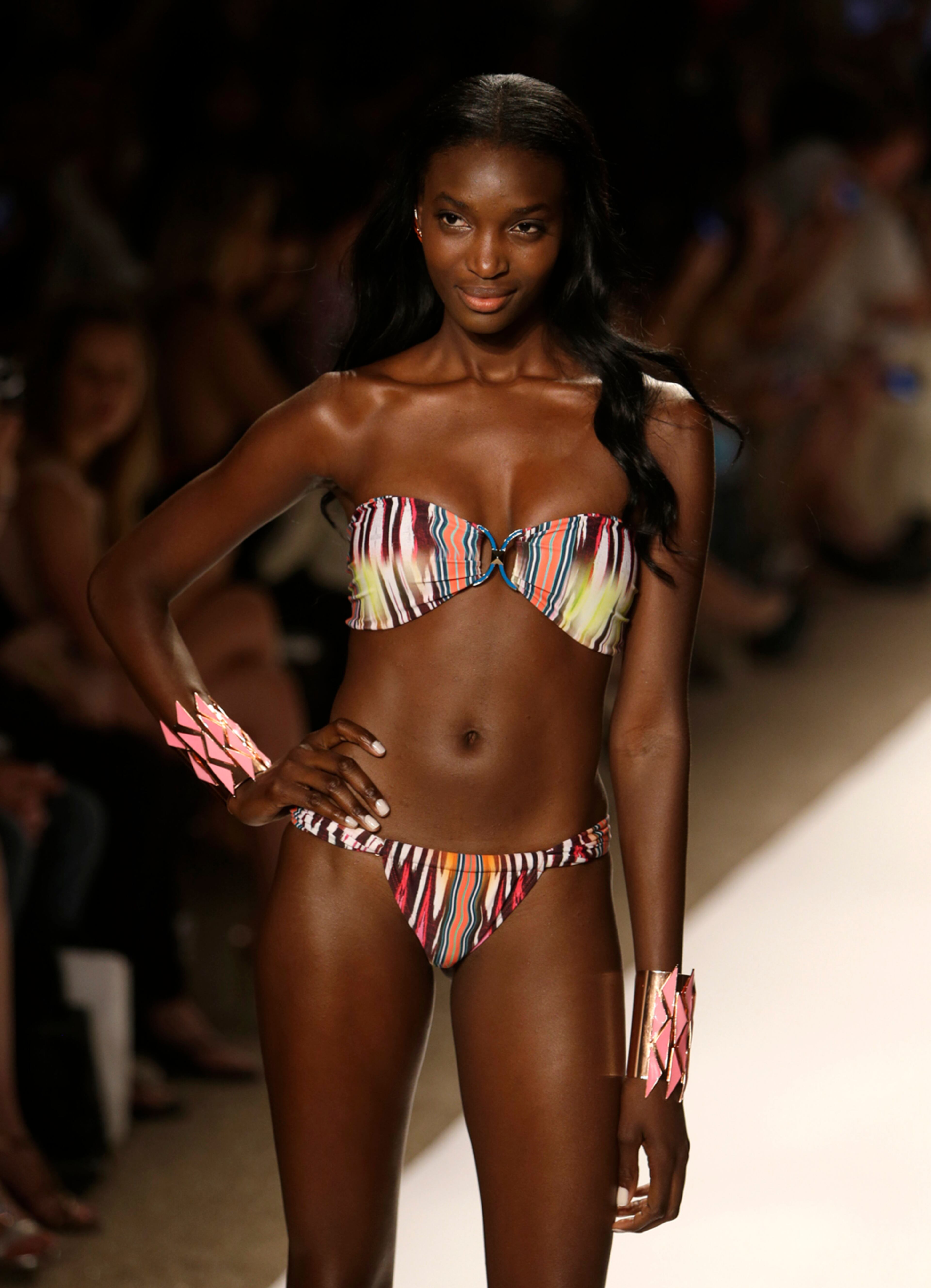 A model walks the runway during the Cia.Maritima show at the Mercedes-Benz Fashion Week Swim 2014, Saturday, July 20, 2013, in Miami Beach, Fla. (AP Photo/Lynne Sladky)
