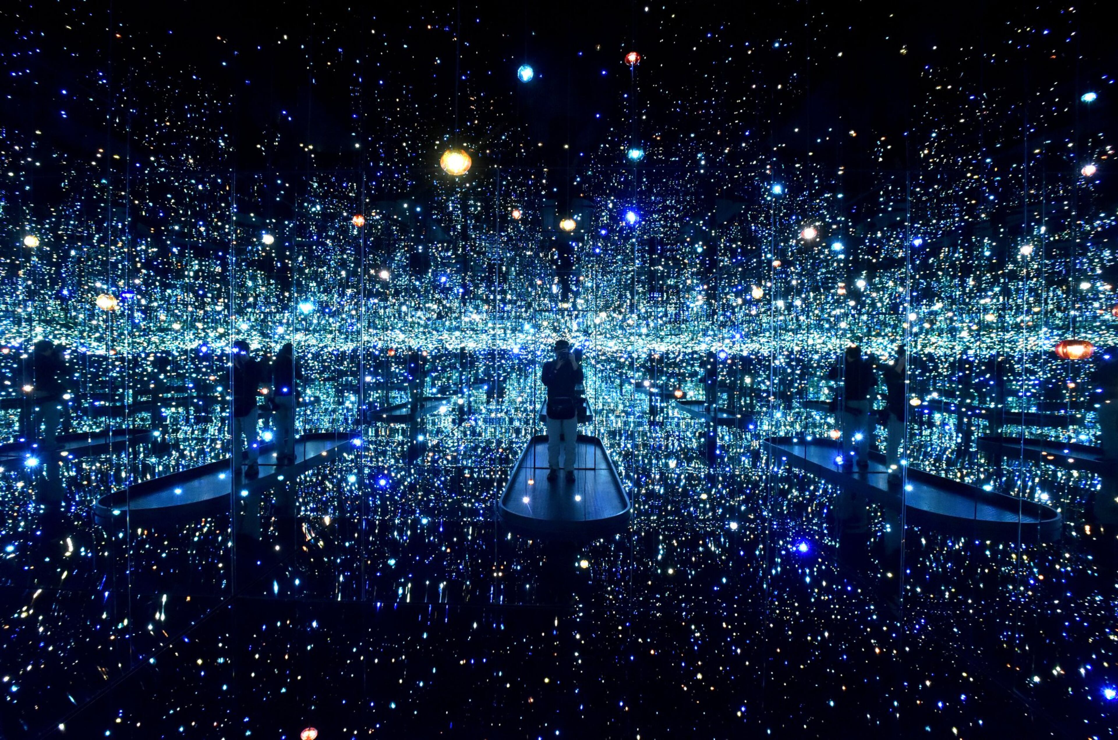 “The Souls of Millions of Light Years Away” is the first “Infinity Mirrors” room that visitors encounter when entering the exhibit “Yayoi Kusama: Infinity Mirrors” at the High Museum. The exhibition presents several of these rooms as well as sculptures, paintings, works on paper, film excerpts, archival ephemera, and additional large-scale installations that span from the early 1950s to the present day. HYOSUB SHIN / HSHIN@AJC.COM